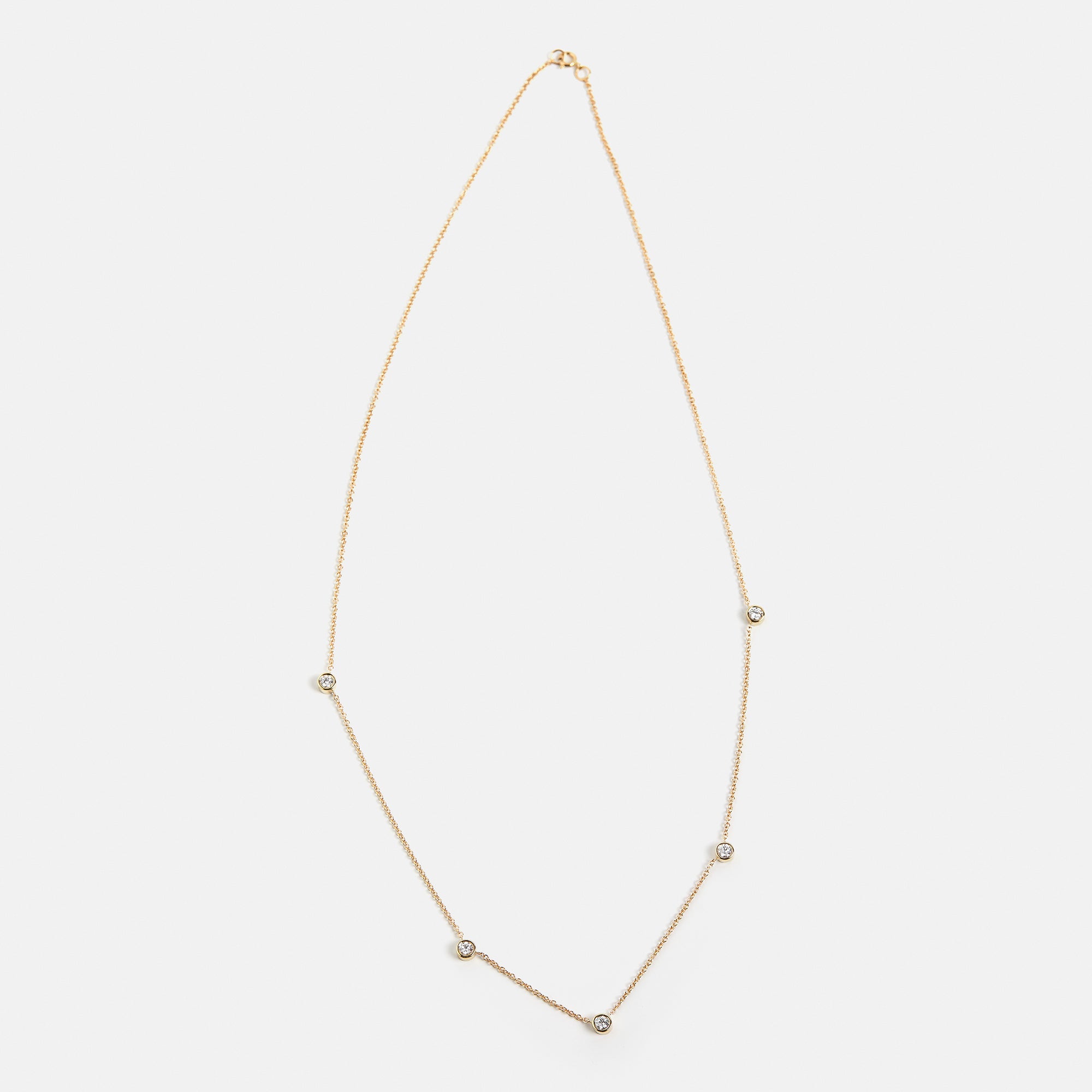 Cool Necklace with asymmetrical lab created white diamond station settings in 14 karat gold by SHW best fine jewelry stores in NYC