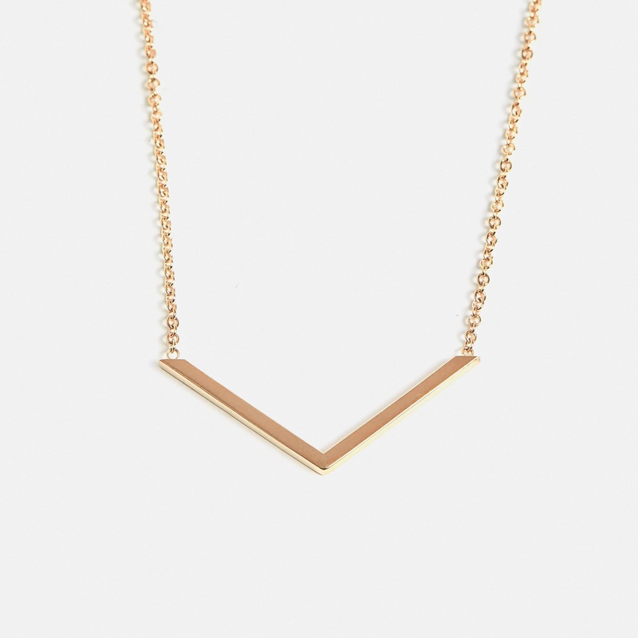 Minimalist Necklace with V shape refined pendant design in 14 karat gold by SHW best fine jewelry store in downtown NYC near me