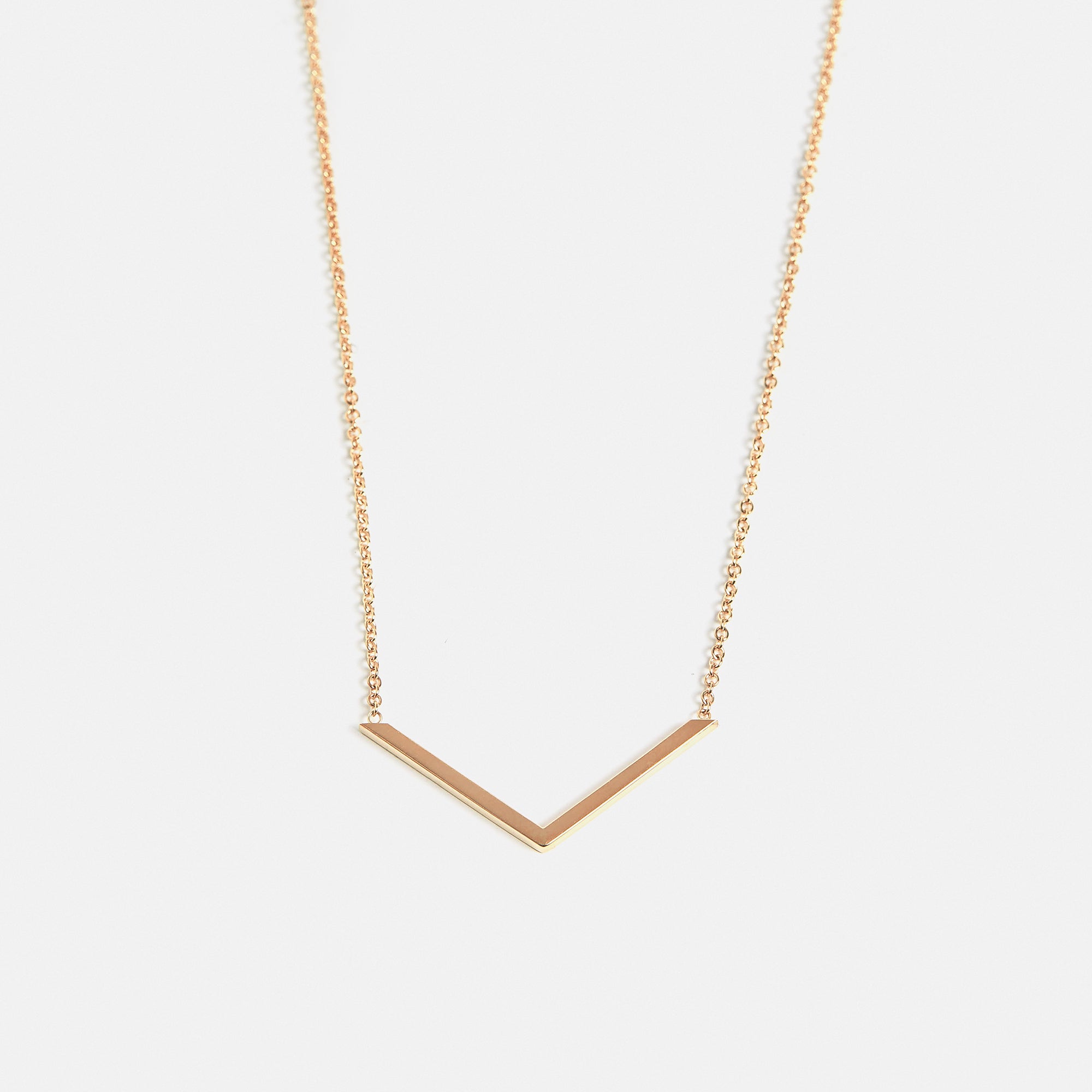 Designer necklace with v-shaped simple geometric pendant in solid 14k gold by SHW cool fine jewelry store Soho East Village NYC