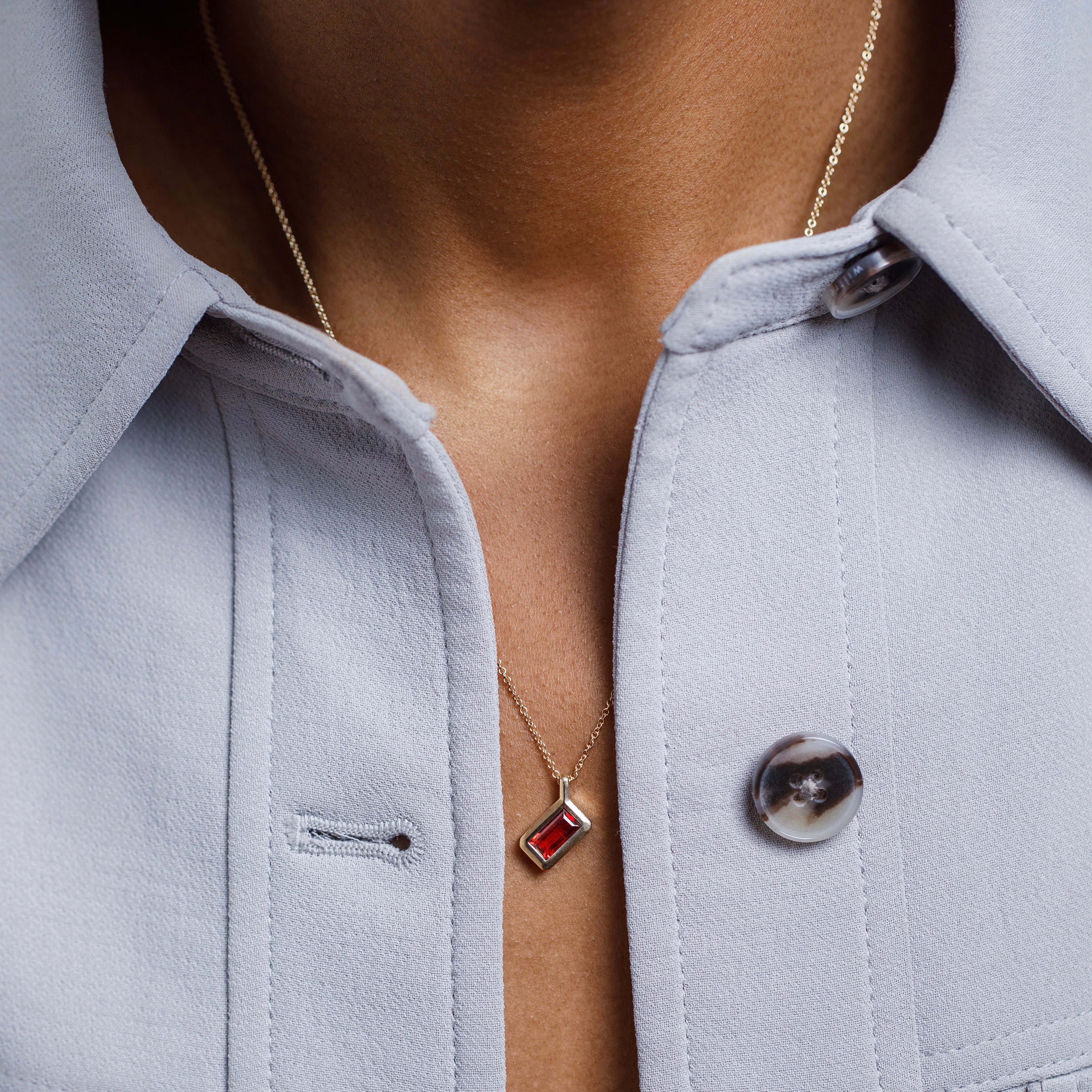 Simple necklace with dainty chain and ruby red garnet pendant in 14k or 18k gold by SHW famous fine jewelry store in NYC East Village