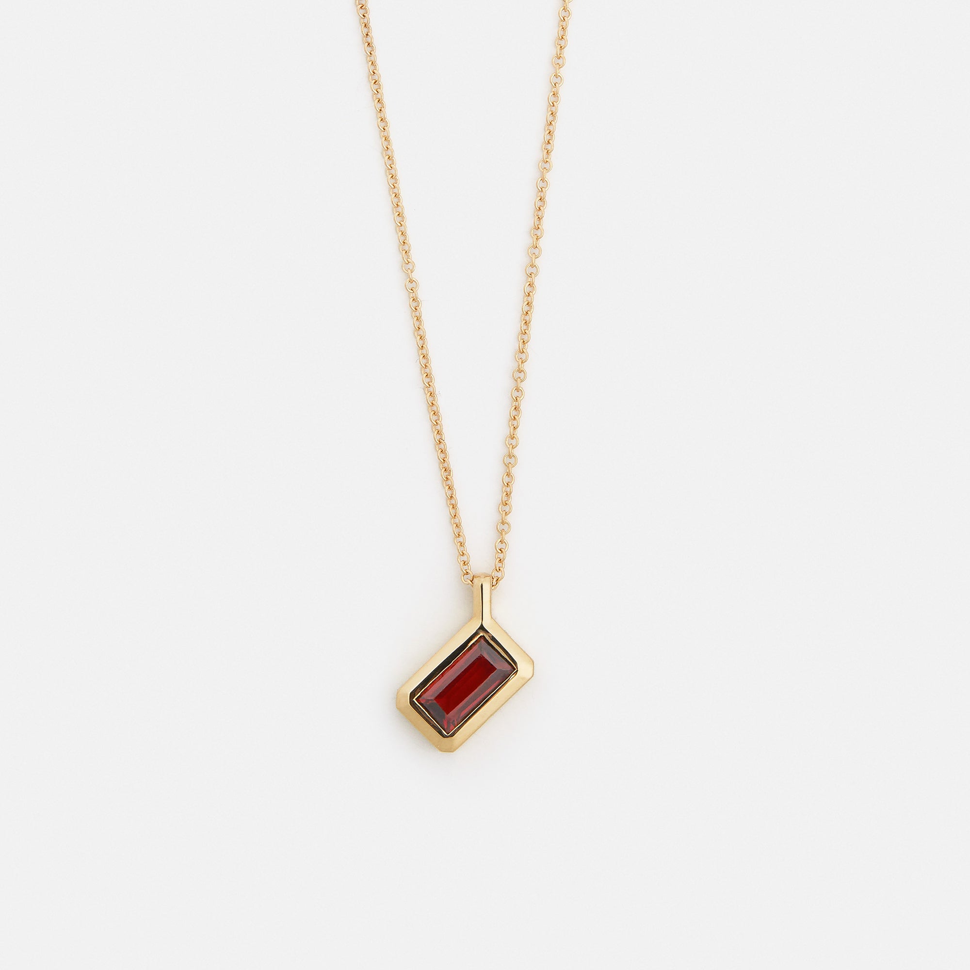 Unique necklace with dainty chain and red garnet pendant in solid 14k gold by SHW cool fine jewelry stores in downtown NYC near me