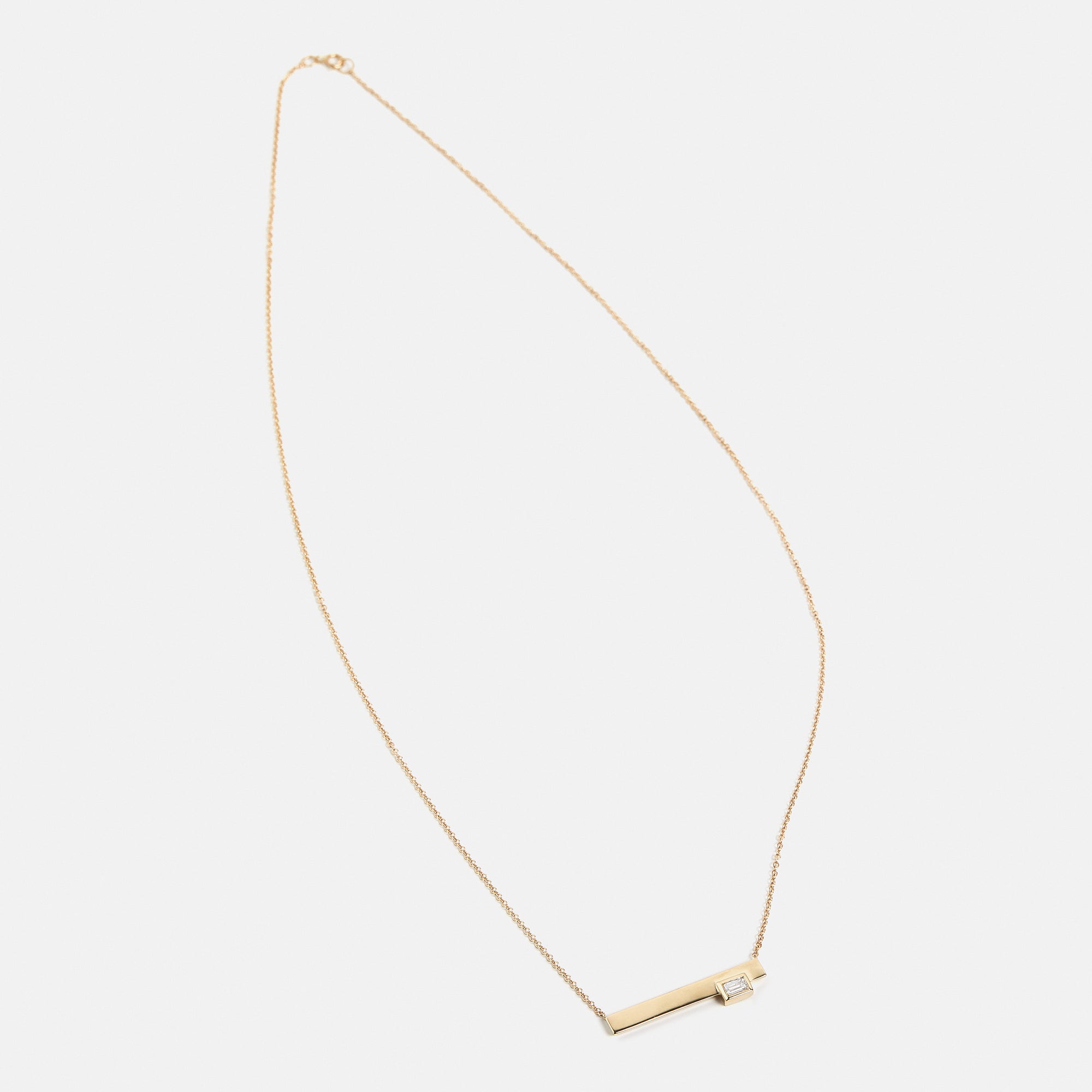 Designer necklace with dainty chain and simple pendant with lab grown baguette white diamond in 14k 18k gold SHW fine jewelry stores in NYC