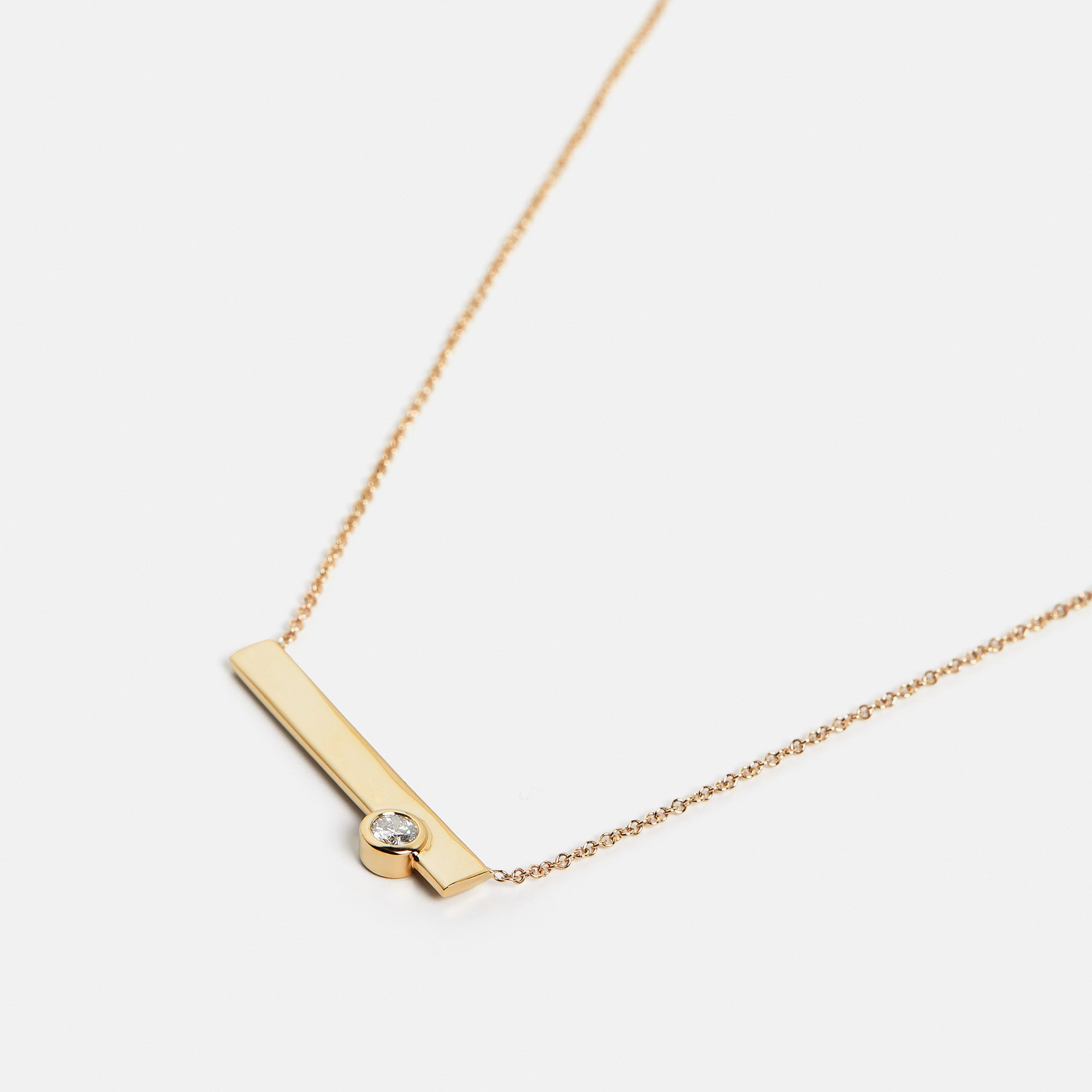 Designer necklace with dainty chain and simple pendant with lab grown round white diamond in 14k or 18k gold SHW fine jewelry store in NYC