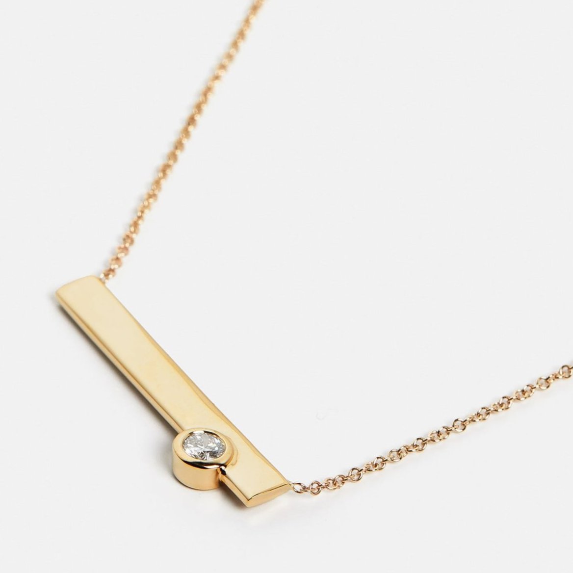 Cool necklace with delicate chain and asymmetrical pendant with lab created round white diamond in 14 karat gold by SHW fine jewelry NYC