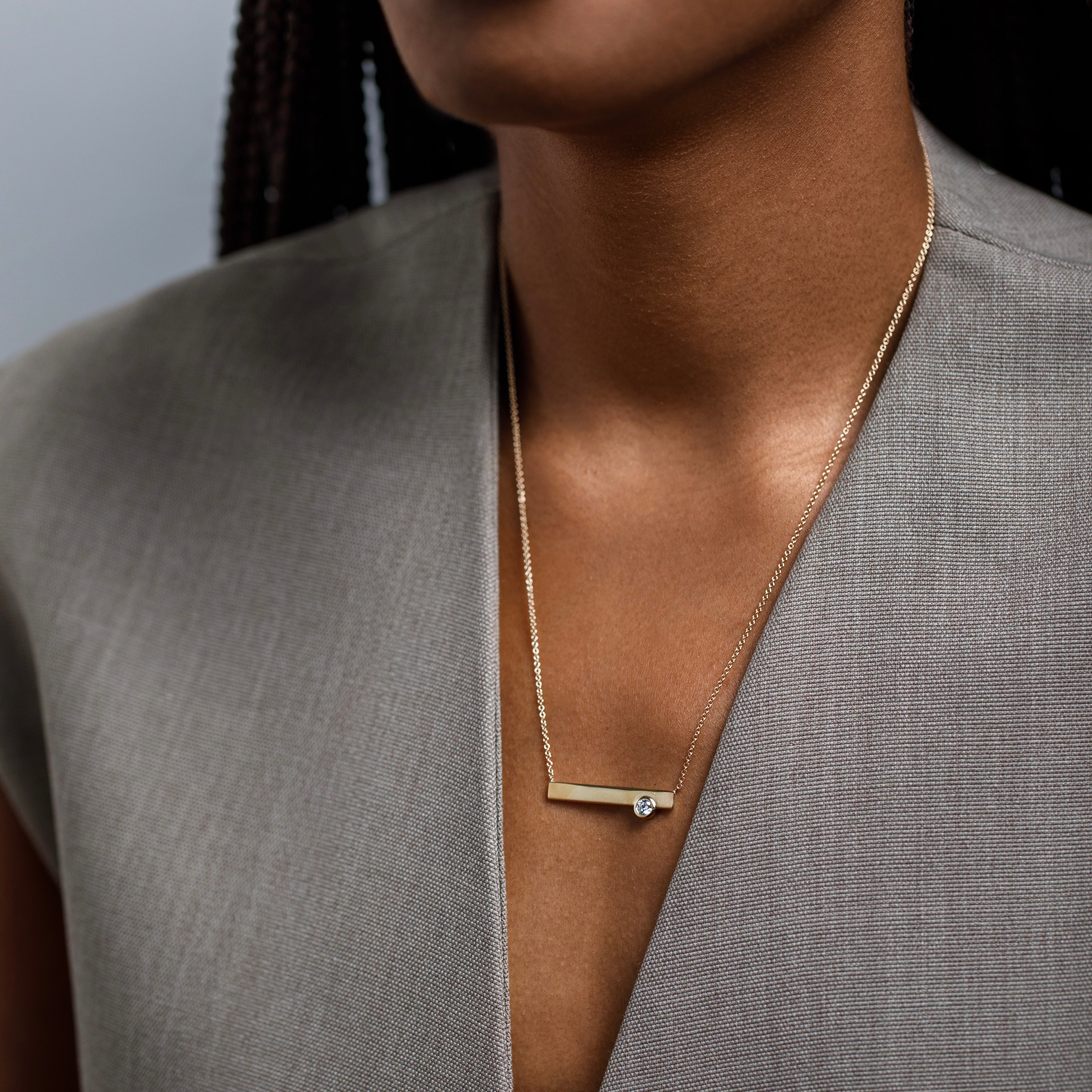 Minimal necklace with asymmetrical pendant with lab made round white diamond in 14k gold by SHW best fine jewelry store in NYC