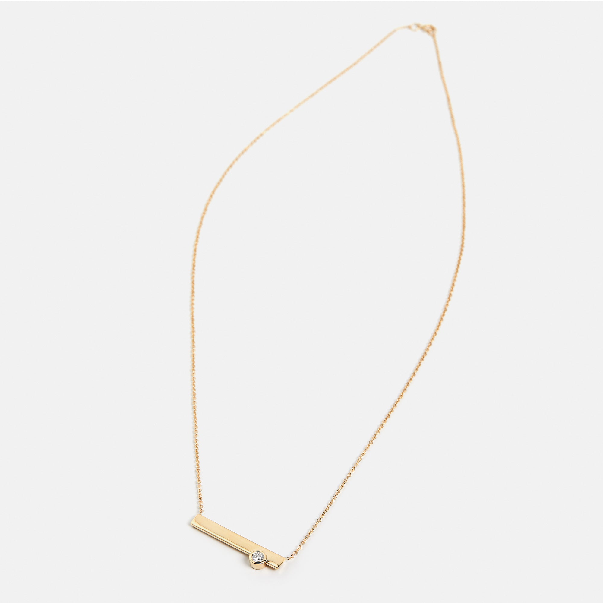 Minimalist necklace with asymmetrical pendant with lab made round white diamond in 14k gold by SHW best fine jewelry store in NYC