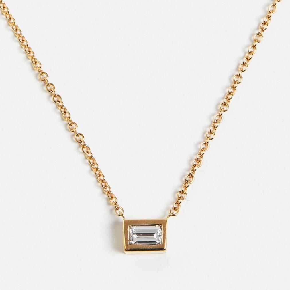 Cool necklace with delicate chain and bezel pendant with lab created baguette white diamond in 14 karat gold by SHW fine jewelry NYC