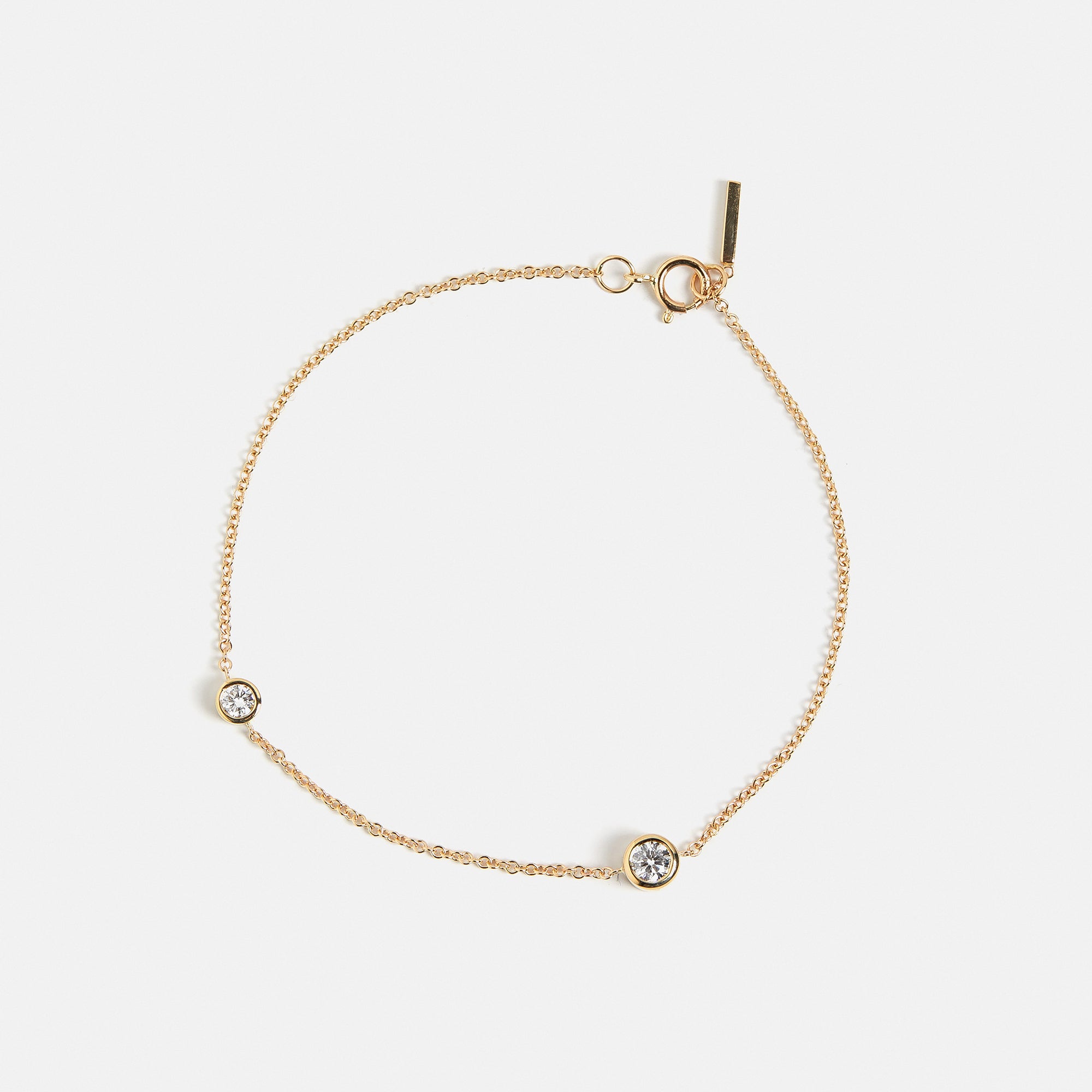 Unique bracelet with dainty chain and asymmetrical lab grown white diamonds in solid 14k gold by SHW cool fine jewelry stores in NYC nearby