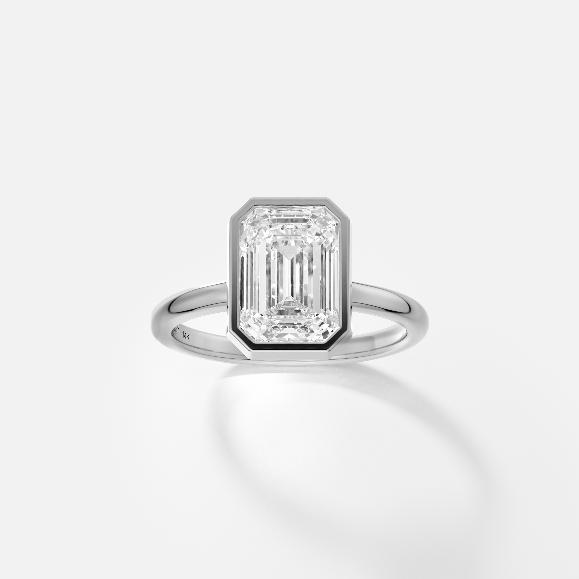Syd emerald cut diamond bezel engagement ring front view in platinum