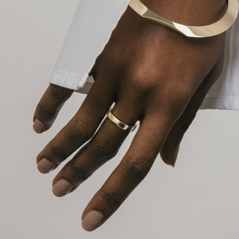 3mm flat and domed wedding band displayed on hand