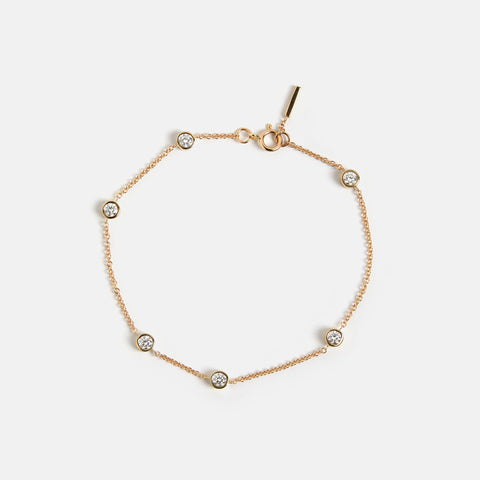 Unique bracelet with dainty chain and asymmetrical lab grown white diamonds in solid 14k gold by SHW cool fine jewelry store in NYC nearby