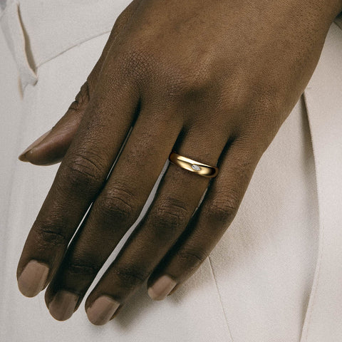 Marquise diamond wedding band with domed profile shown worn in natural light