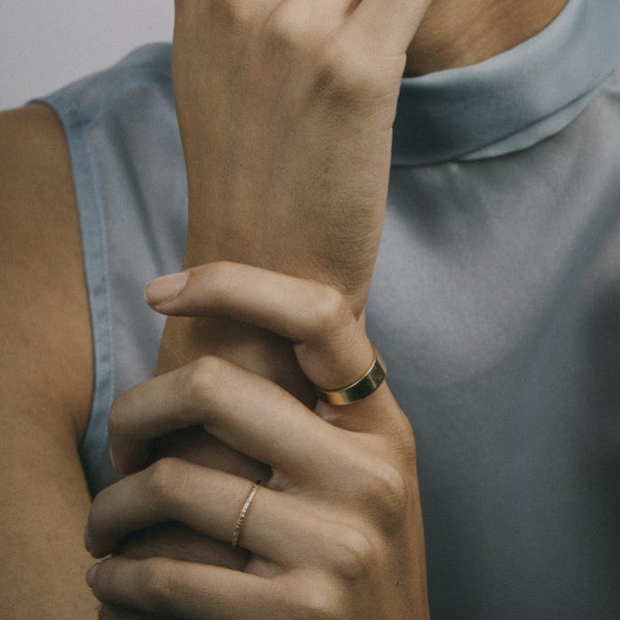 Thin diamond half eternity band worn on hand