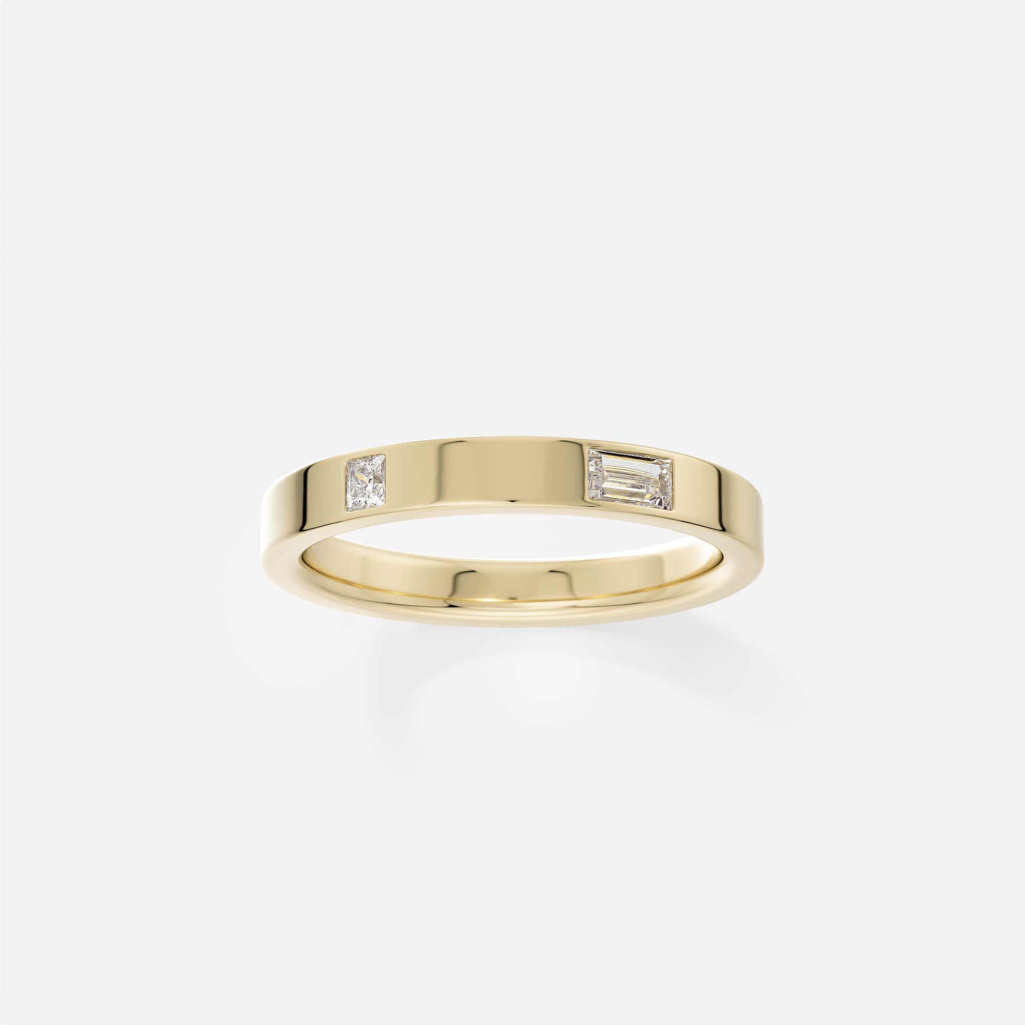 14k yellow gold flat profile band with one baguette and one princess-cut diamond
