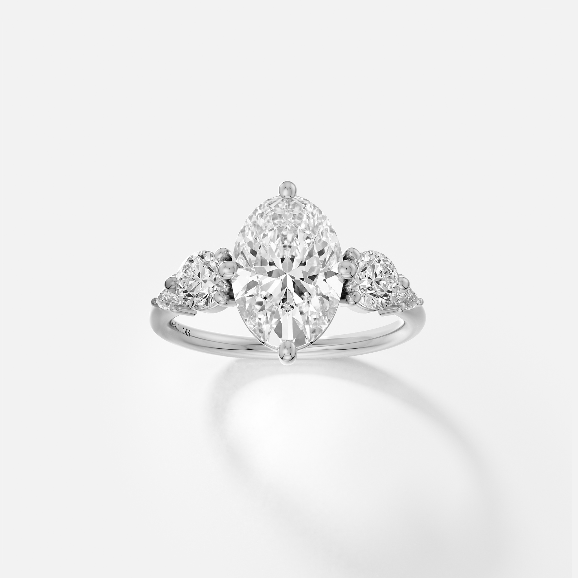 platinum five stone engagement ring with 2.50 carat oval diamond and pear and round side stones on delicate band