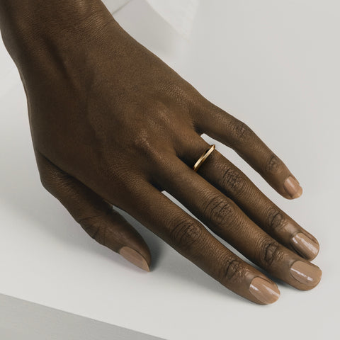 Minimal 2mm knife edge band shown worn in natural light