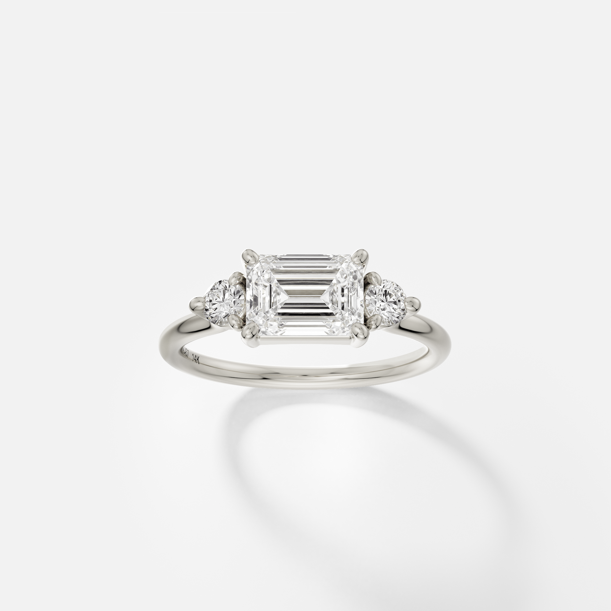 Kala east west emerald diamond three stone engagement ring front view in 14k white gold