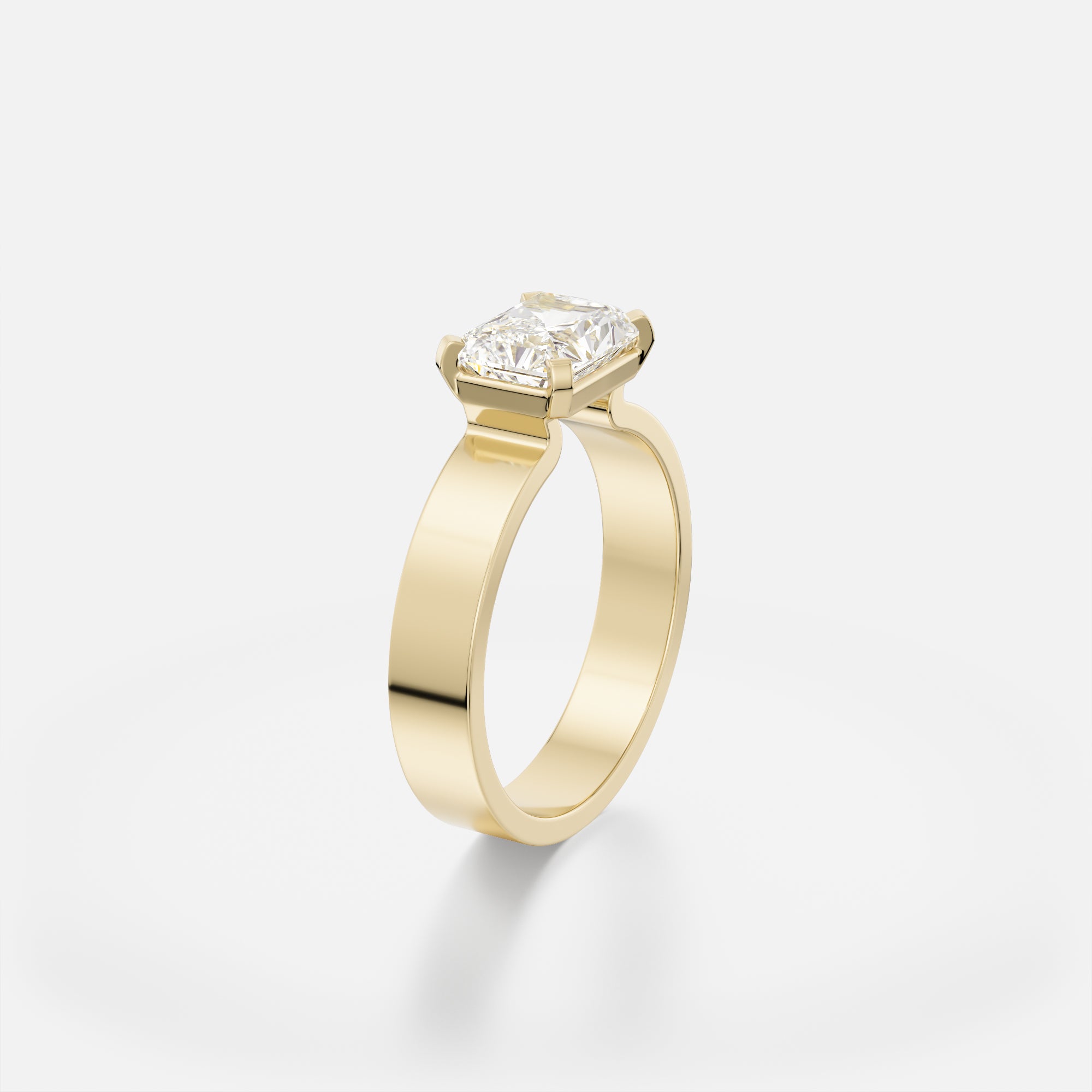 Sculptural flat band engagement ring with 1.5 ct radiant-cut diamond set east west in delicate corner prongs