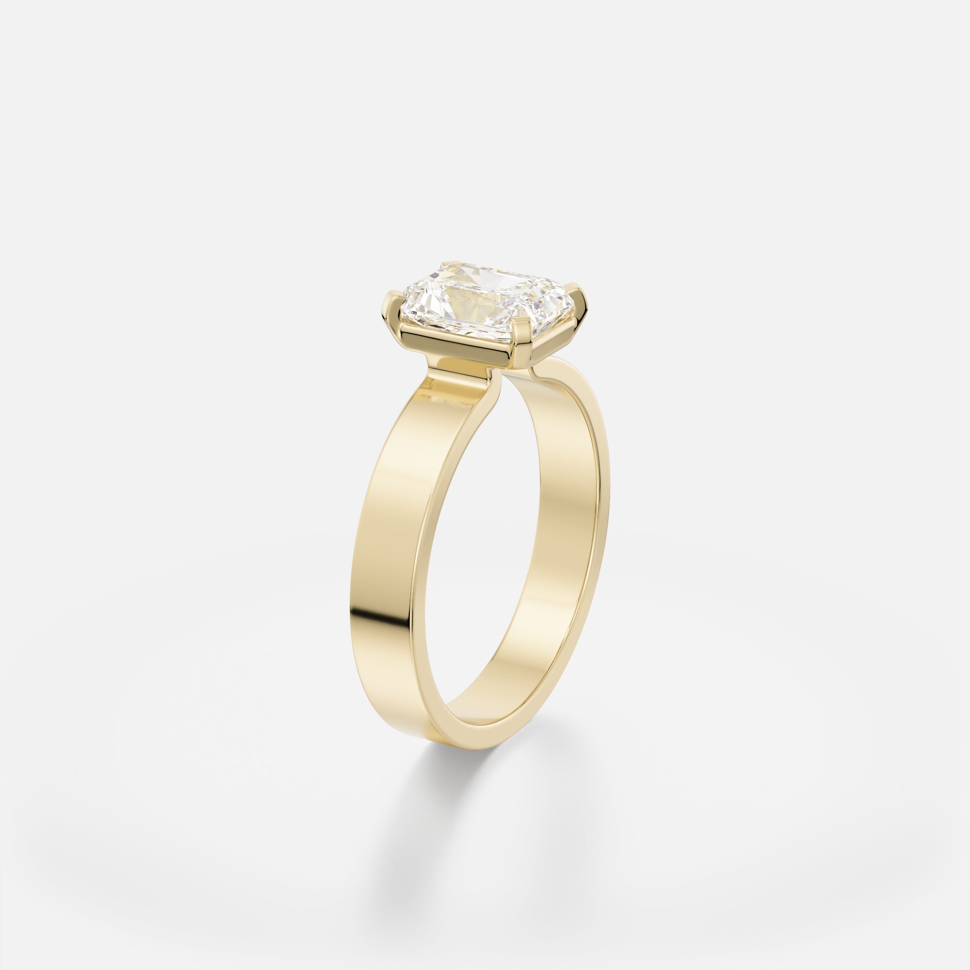 Sculptural flat band engagement ring with 1.5 ct radiant-cut diamond set north-south in delicate corner prongs