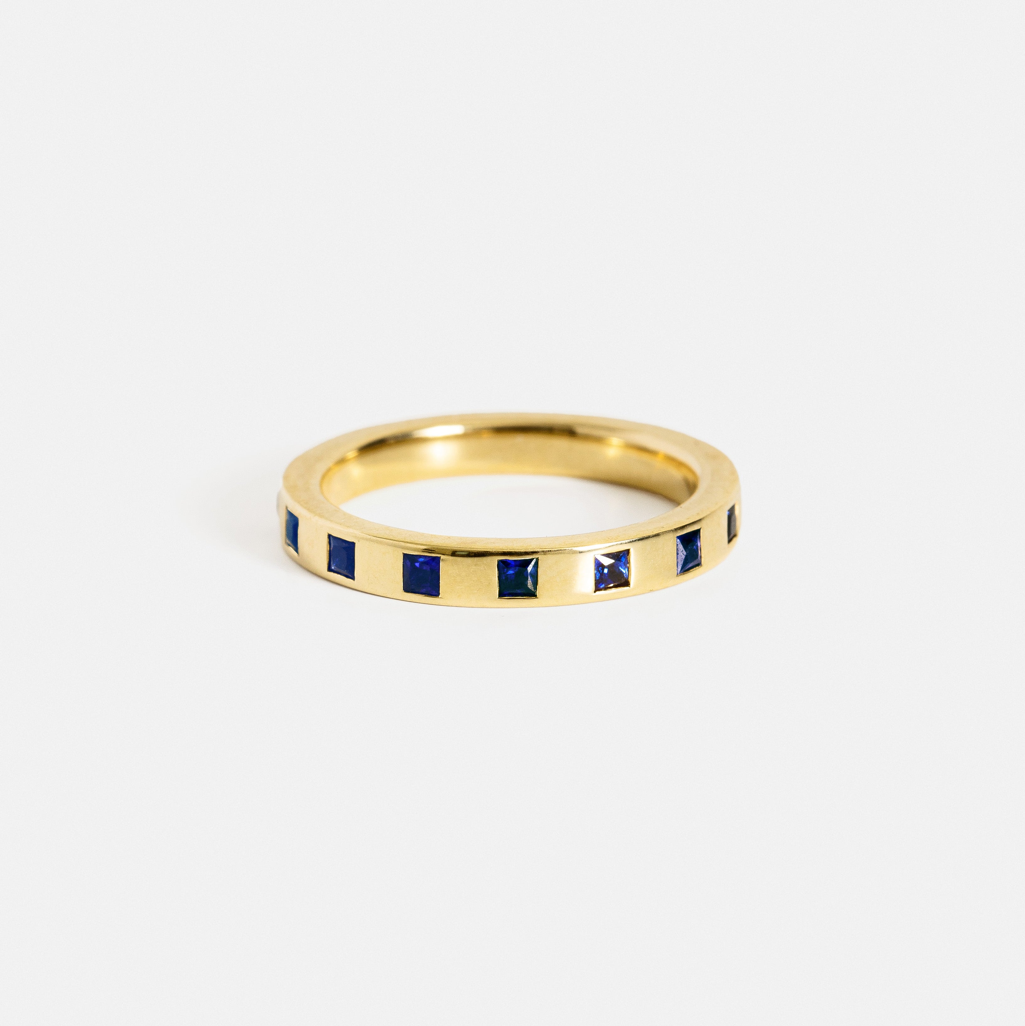 Modern womens wedding band with eternity of princess cut sapphires in solid 14k yellow, white, rose gold, platinum by SHW fine jewelry in NYC