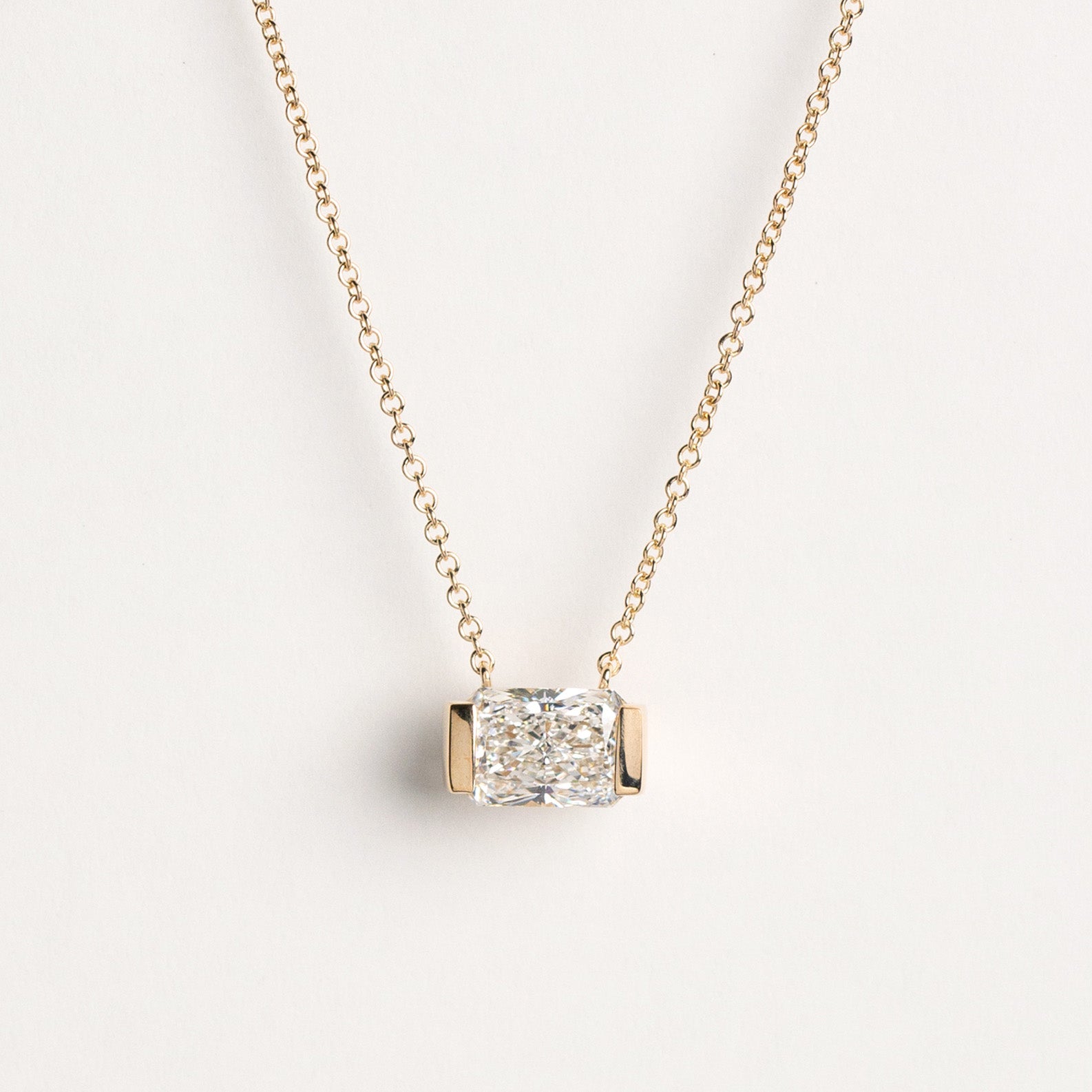 Radiant-cut lab-grown diamond half-bezel necklace in 14k yellow gold