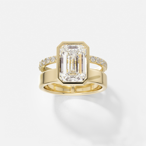 14k yellow gold engagement ring with 4.00 carat emerald-cut diamond in bezel setting and pavé diamond eternity band on double band design
