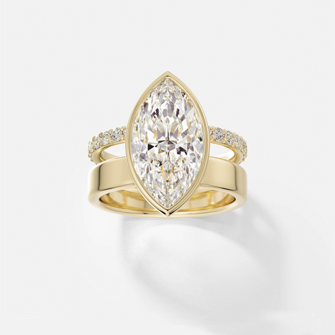14k yellow gold engagement ring with 4.00 carat marquise diamond set north-south in bezel setting with pavé diamond eternity band