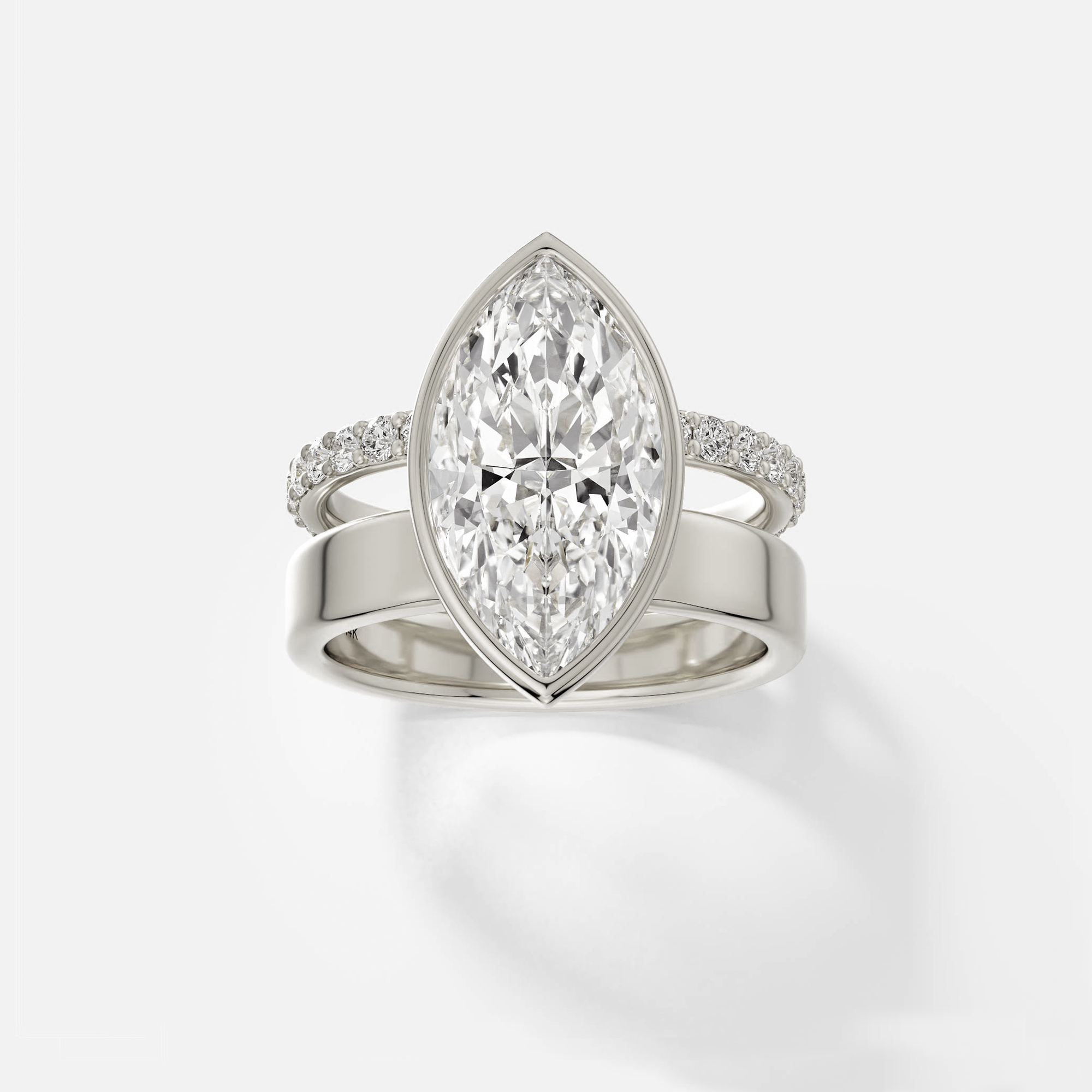 14k white gold engagement ring with 4.00 ct marquise diamond bezel set with pavé diamond eternity band