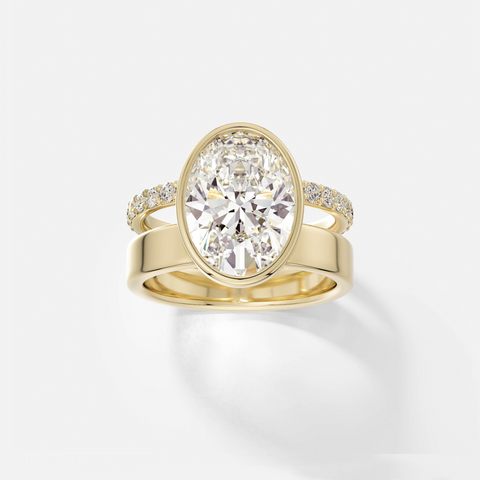 14k yellow gold engagement ring with 4.00 carat oval diamond set north-south in bezel setting with pavé diamond eternity band