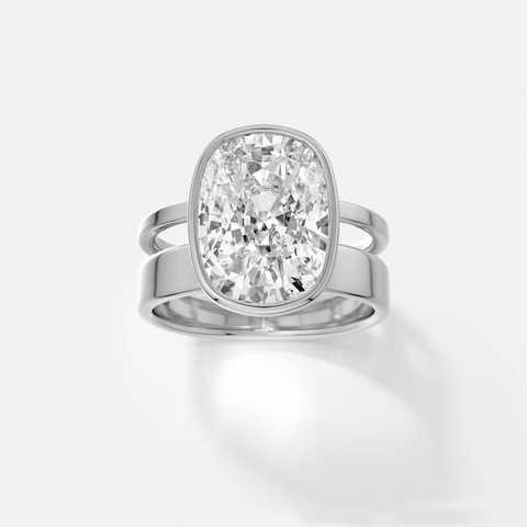 platinum engagement ring with 4.00 carat cushion-cut diamond in bezel setting on contemporary double band
