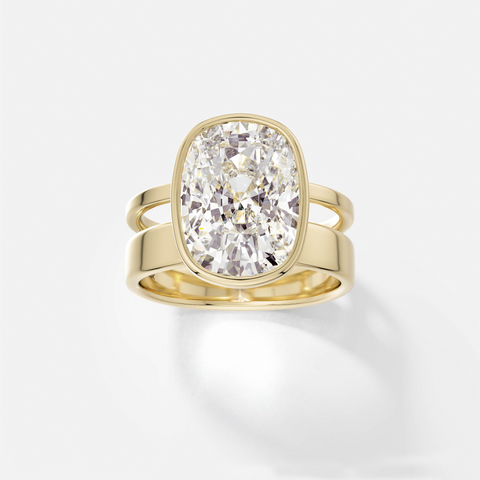 14k yellow gold engagement ring with 4.00 carat cushion-cut diamond set north-south in bezel setting on sculptural double band