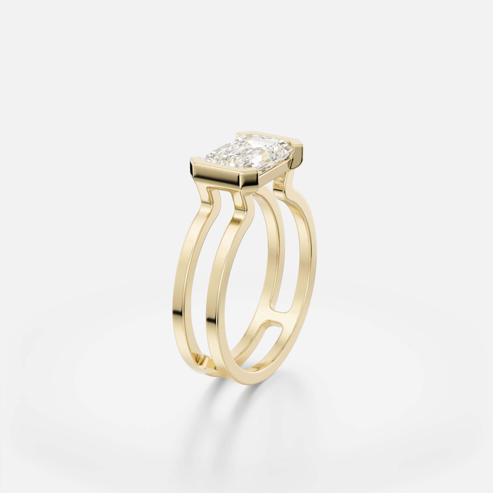 1.75 ct east west emerald diamond engagement ring with sculptural double band and open bezel