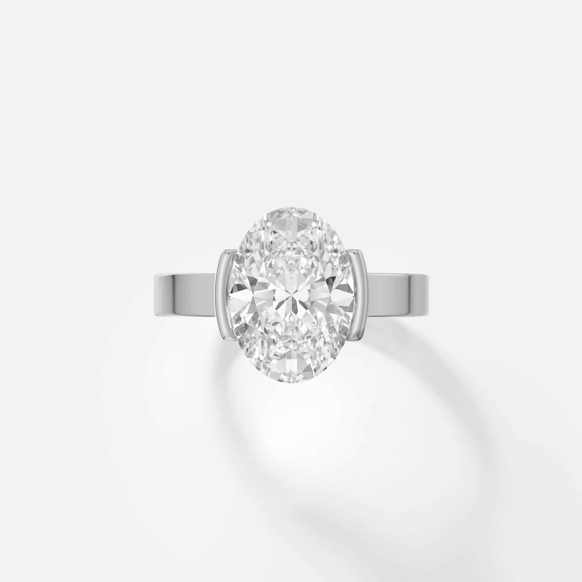 platinum engagement ring with 3.00 carat oval diamond set in tapered partial bezel on wide band