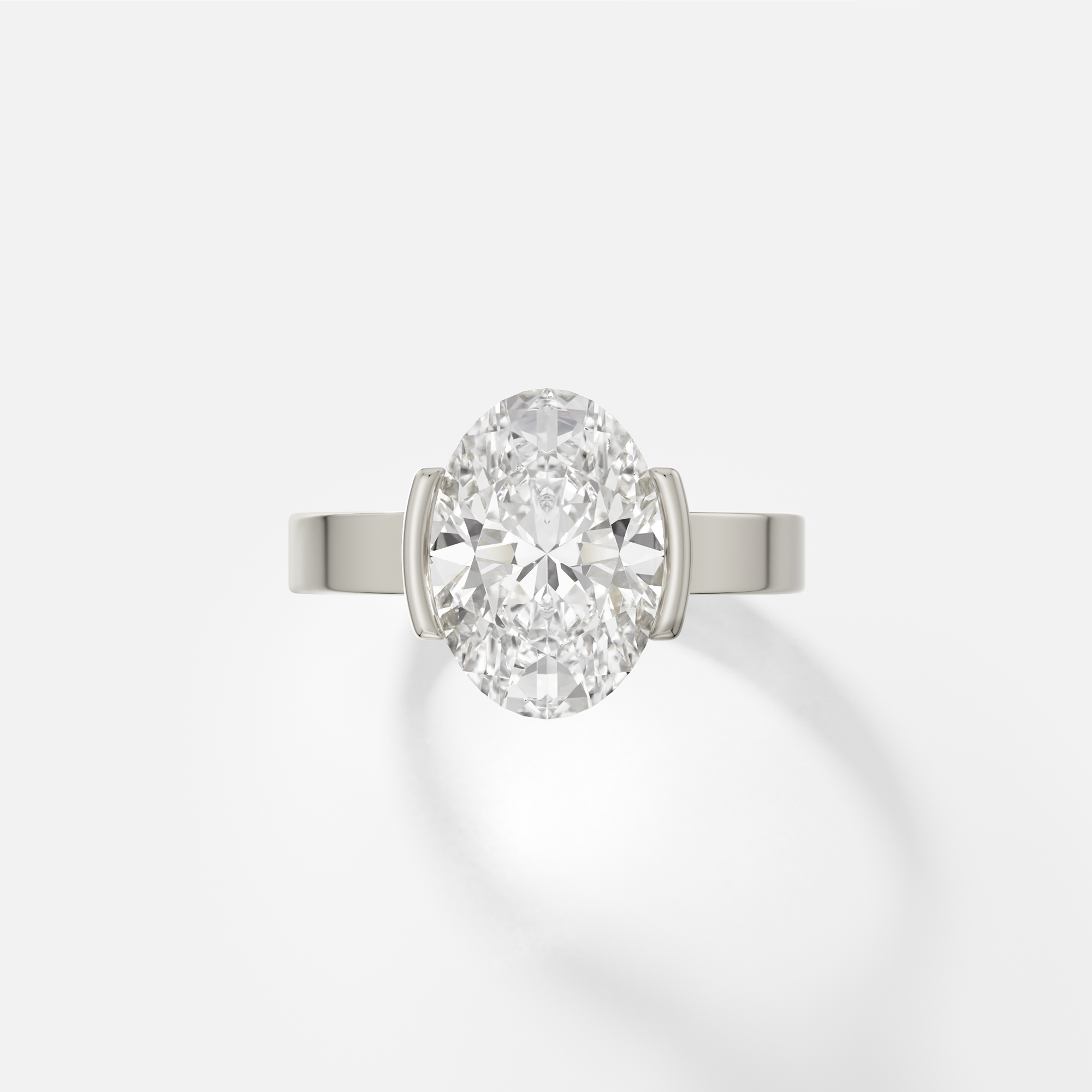 14k white gold engagement ring with 3.00 ct oval diamond in tapered partial bezel setting