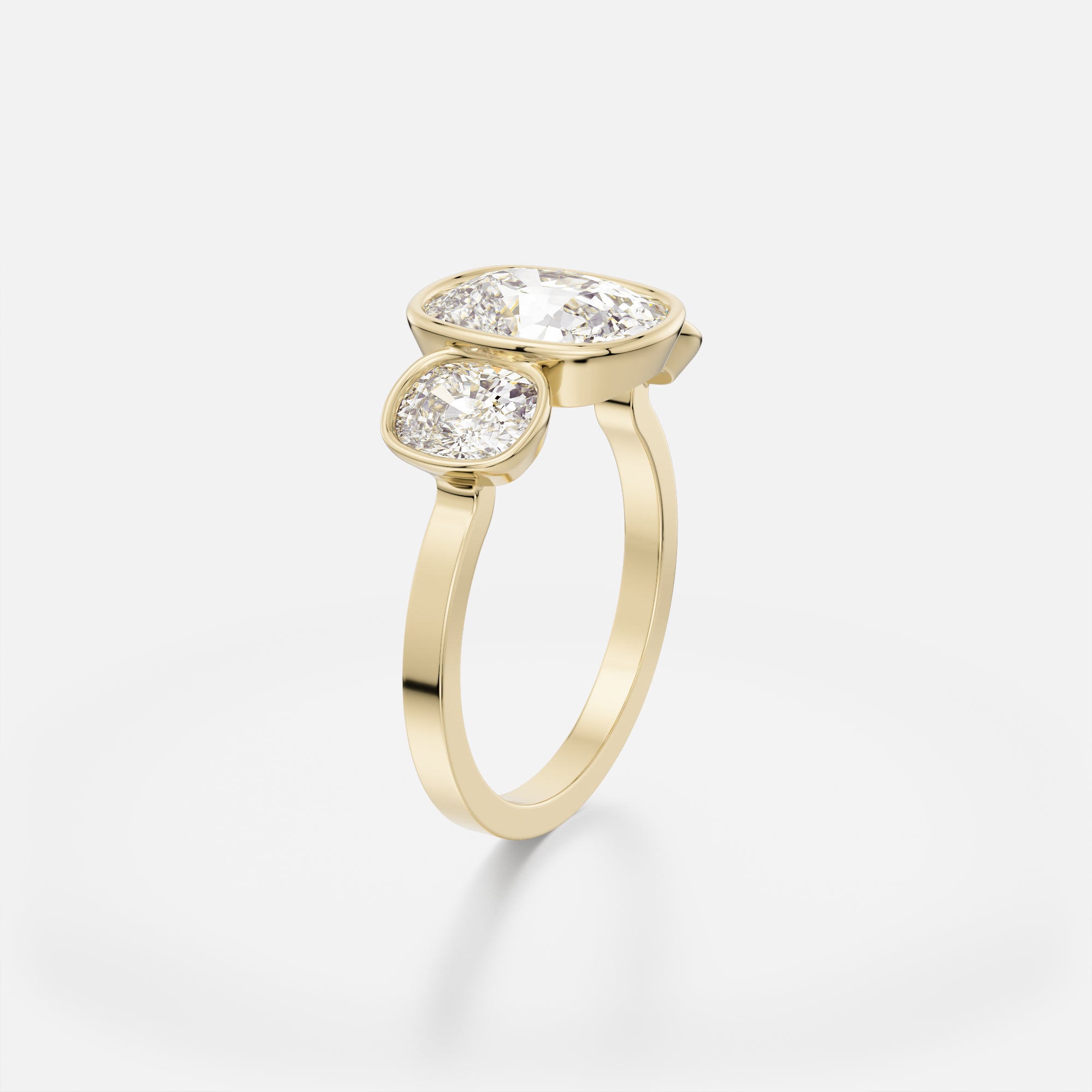 Sculptural three stone engagement ring with elongated cushion diamonds in modern open setting on flat band