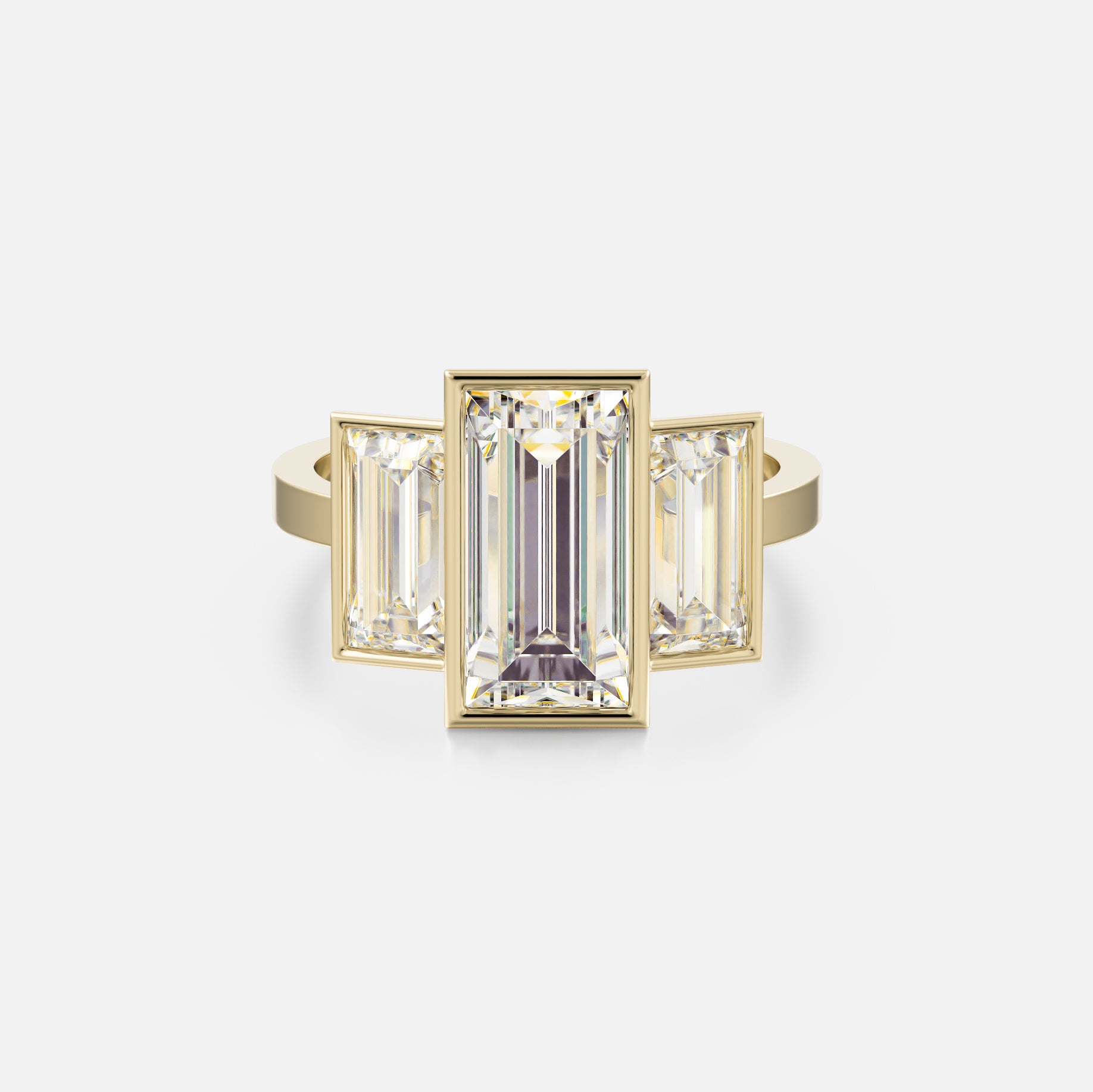 14k yellow gold three stone engagement ring with 3 carat baguette-cut center diamond and two 1 carat baguette side stones on flat band