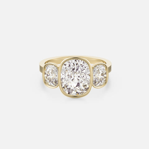 14k yellow gold three stone engagement ring with 3.50 carat elongated cushion center diamond and two elongated cushion side stones on flat band