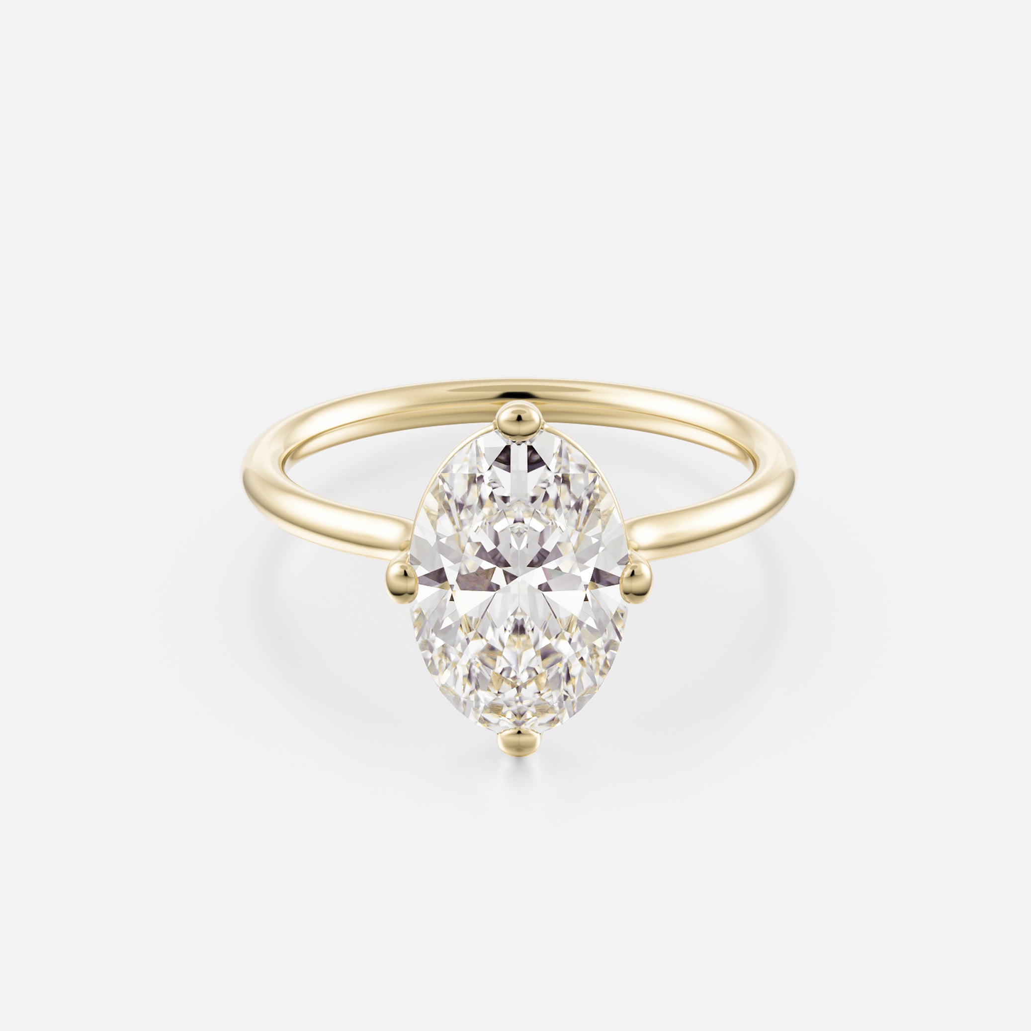 14k yellow gold engagement ring with 2.50 carat oval diamond set north south on thin round profile band