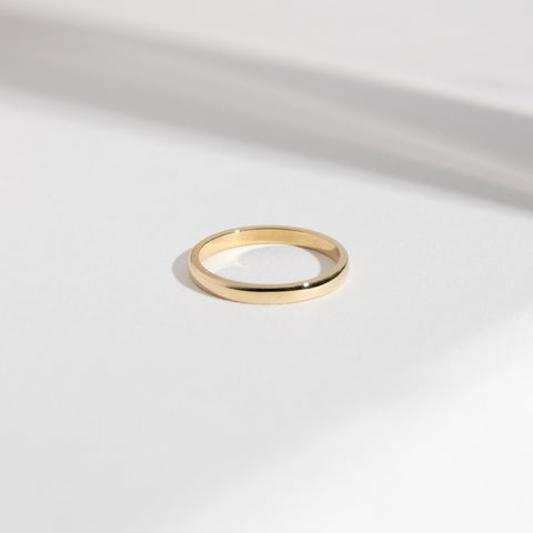14k yellow gold 2mm domed wedding band with smooth rounded profile