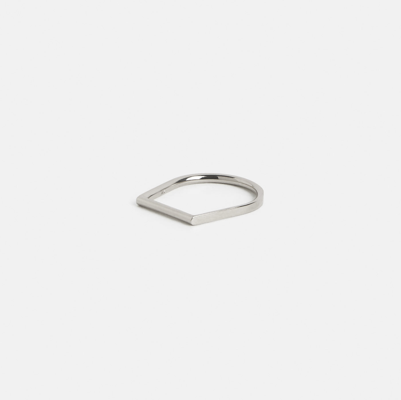14k white gold thin wedding band with abstract silhouette