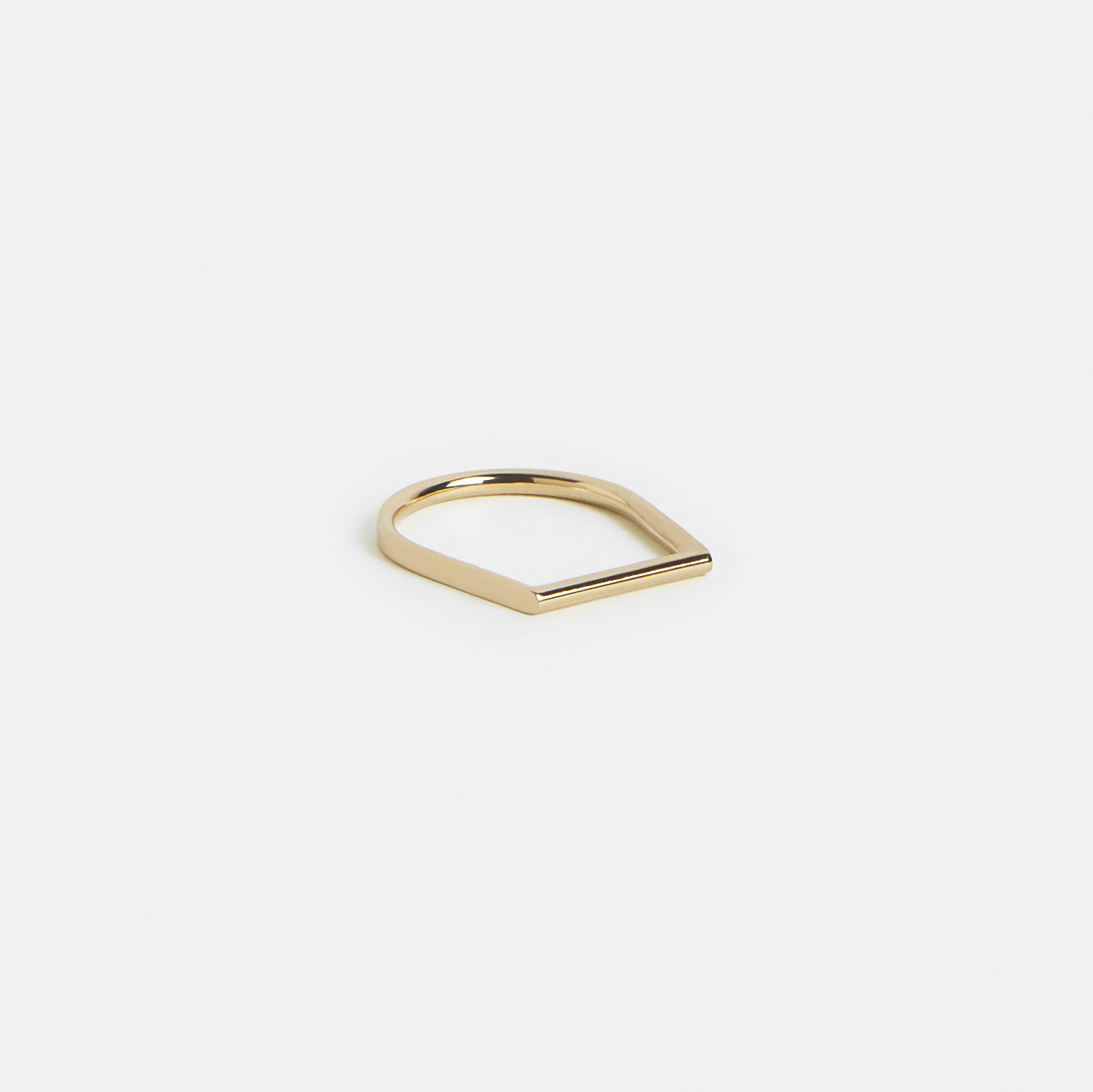 14k yellow gold thin wedding band with abstract silhouette