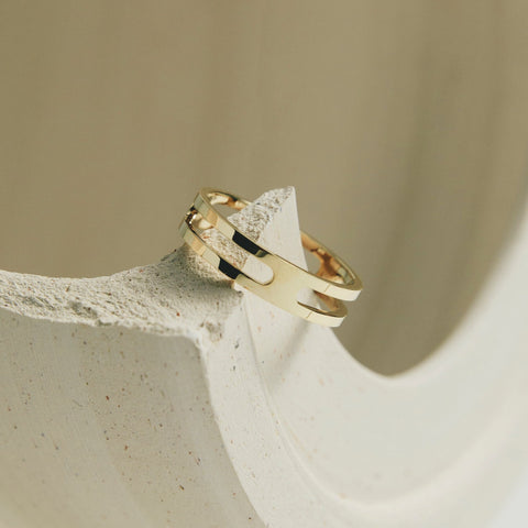 14k yellow gold ring shown at an angle in editorial styling