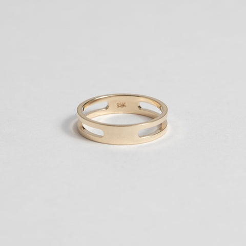 14k yellow gold double band ring with connected design and negative space