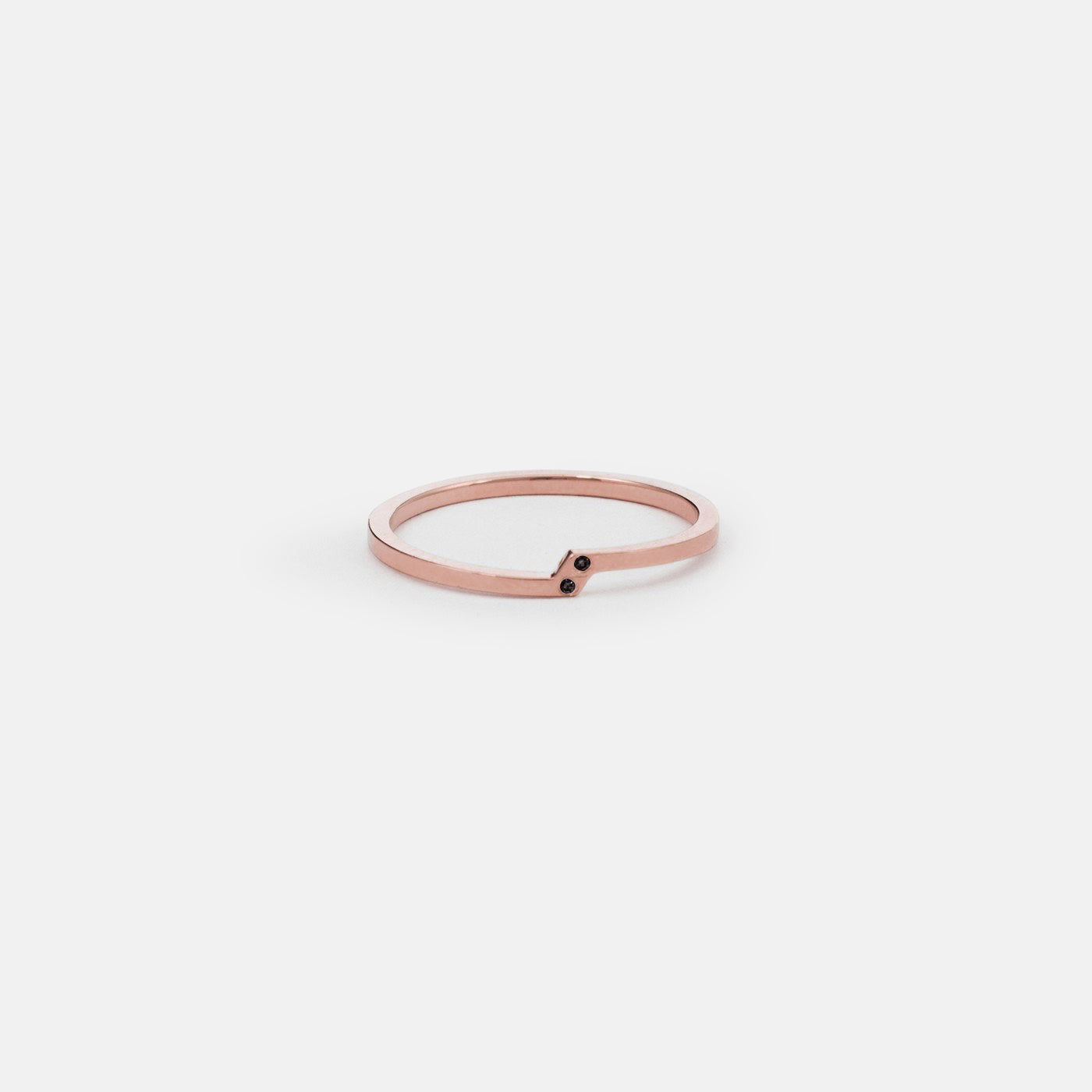 14k rose gold slim ring with two black diagonal diamonds