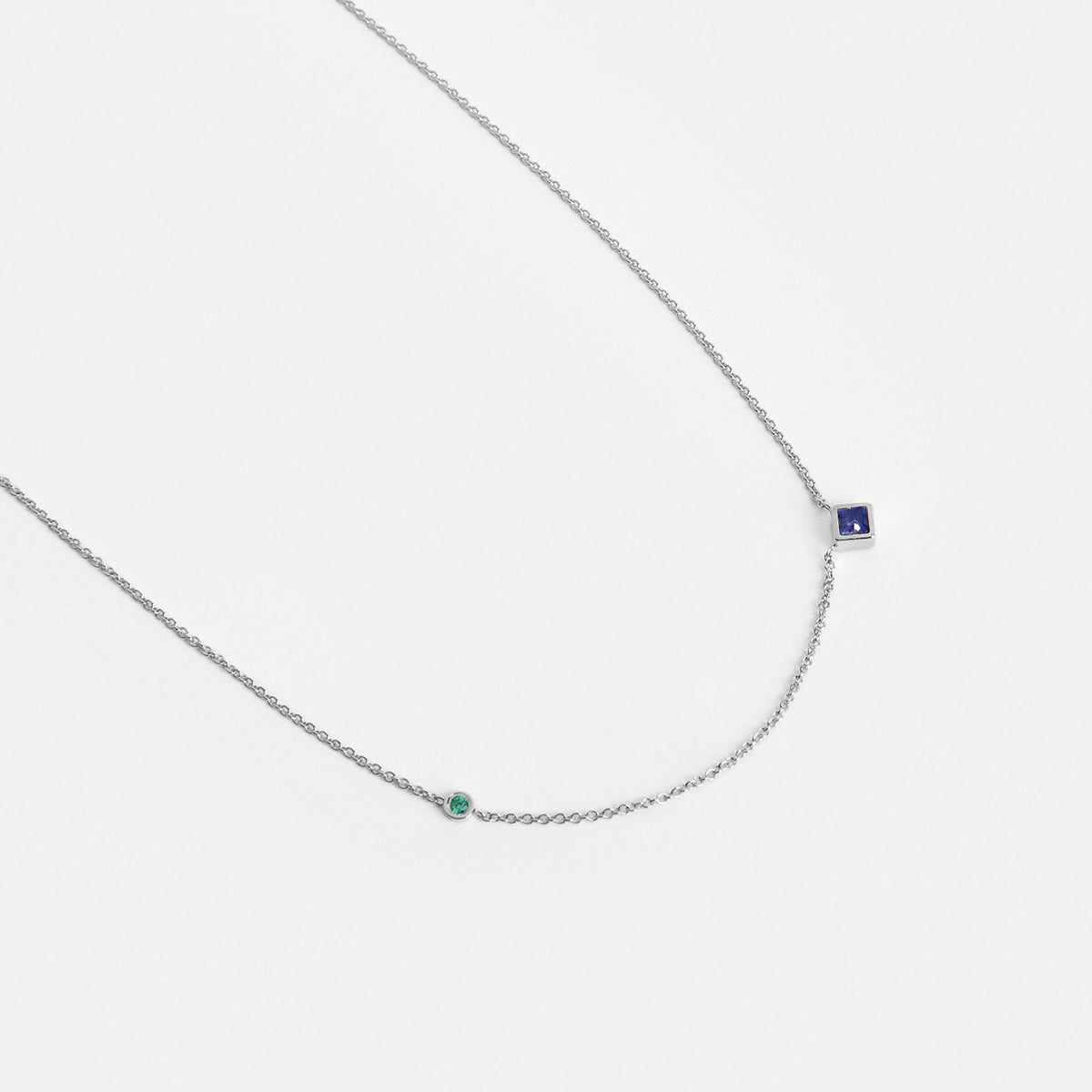 Isu Unique Necklace in 14k White Gold set with Emerald and Sapphire By SHW Fine Jewelry NYC
