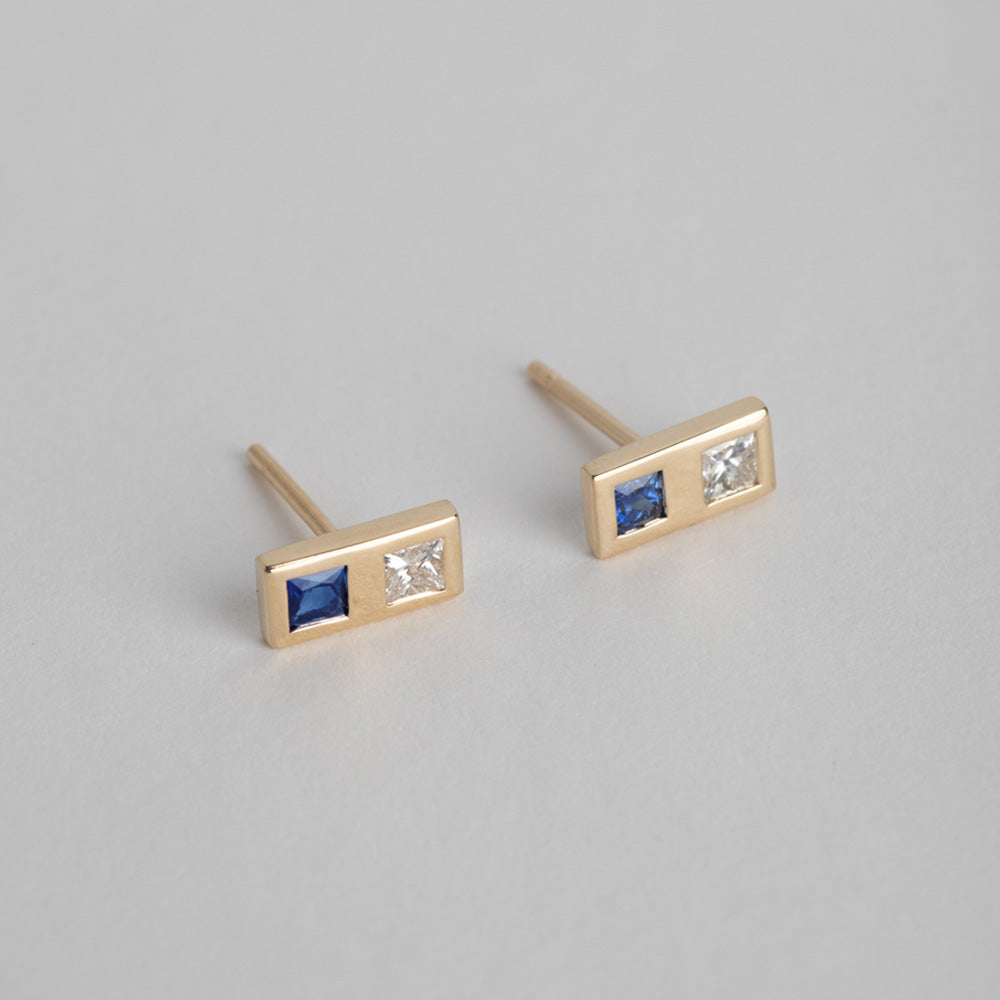 14 karat yellow gold designer earrings set with diamond and sapphire