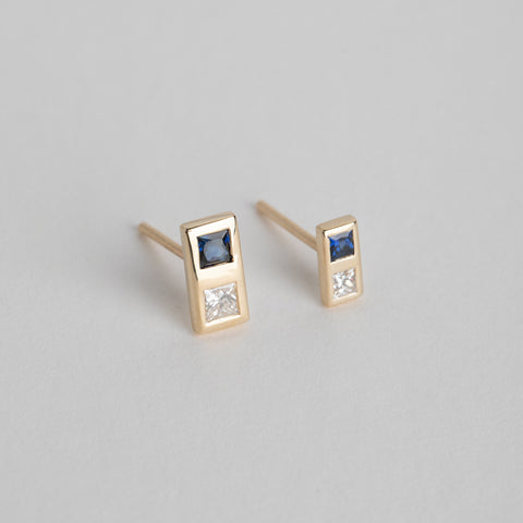 14 karat yellow gold designer earrings set with diamond and sapphire