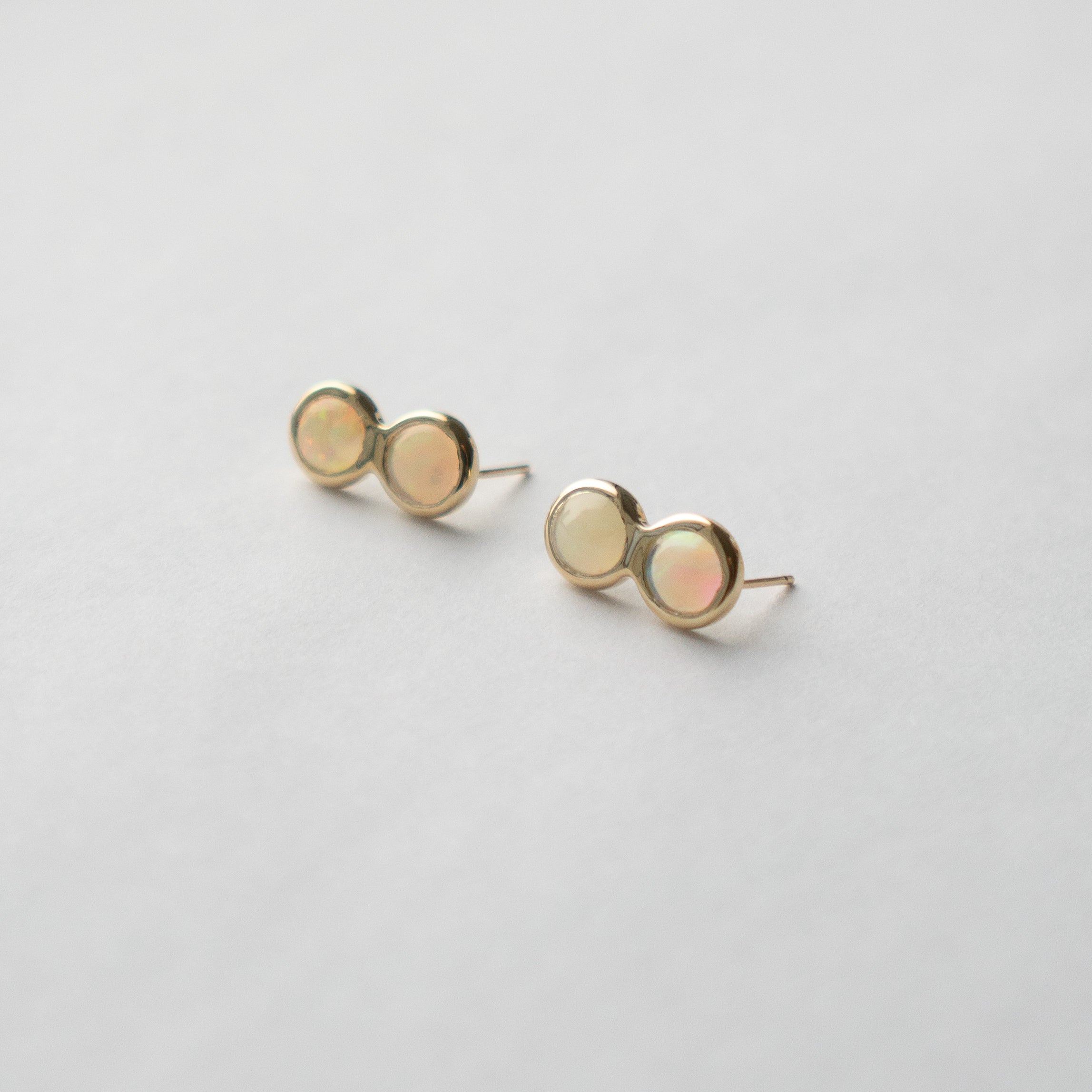 Cool Alia stud earrings in 14 karat yellow gold set with opal gemstone made in NYC by SHW fine Jewelry
