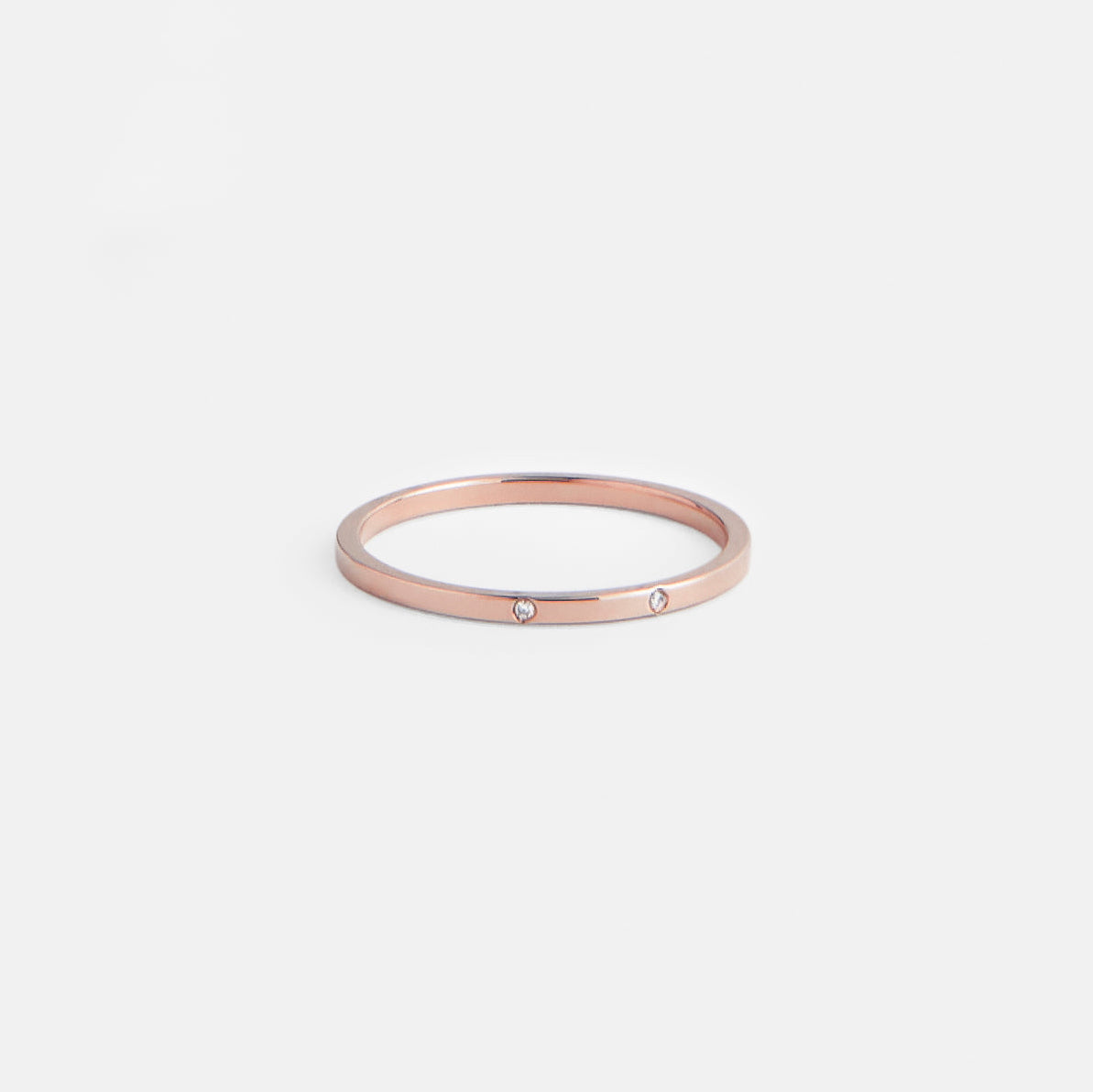 14k rose gold flat profile band with two brilliant-cut white diamonds