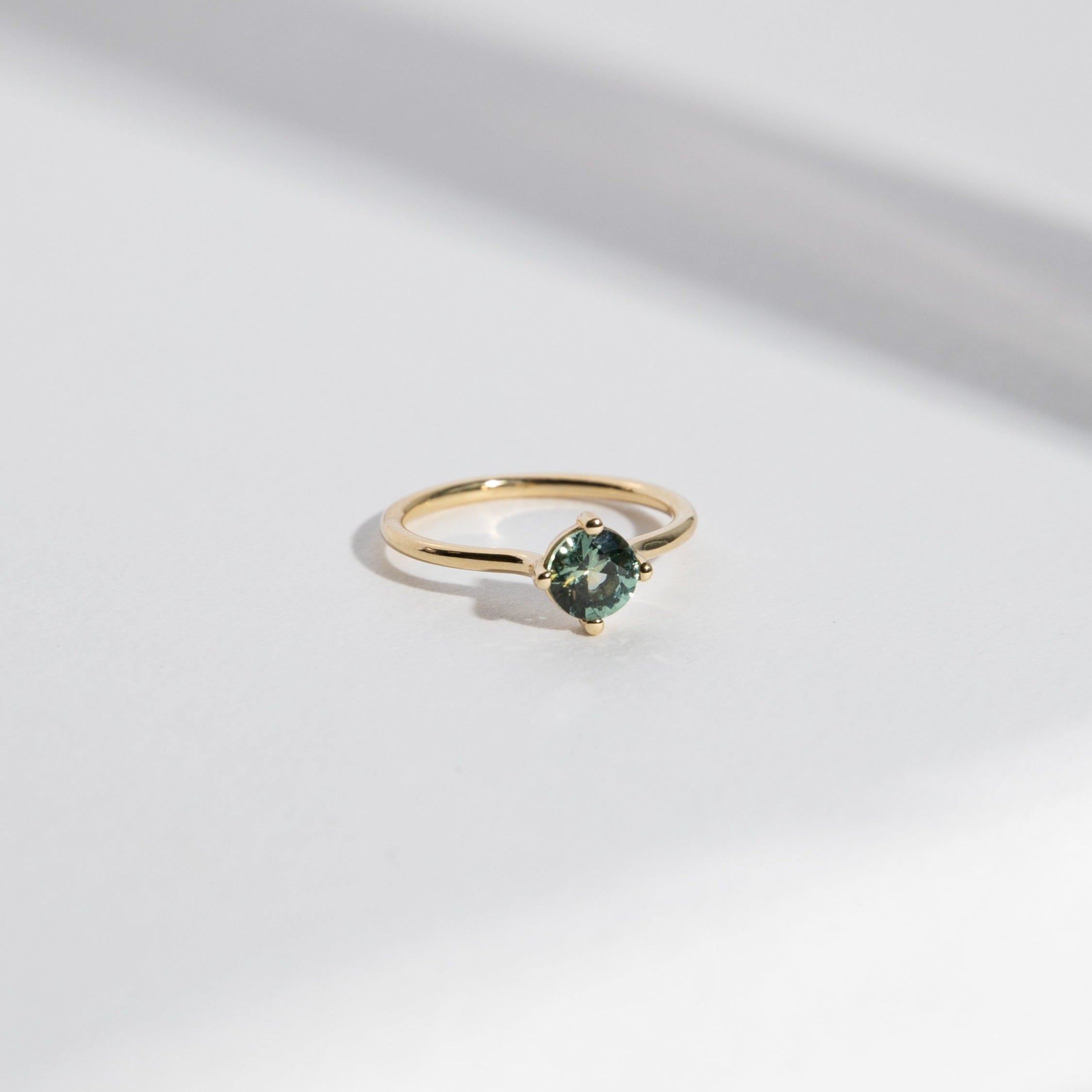 Velu Handmade Ring in 14k Gold set with a 0.8ct round brilliant cut green sapphire By SHW Fine Jewelry NYC